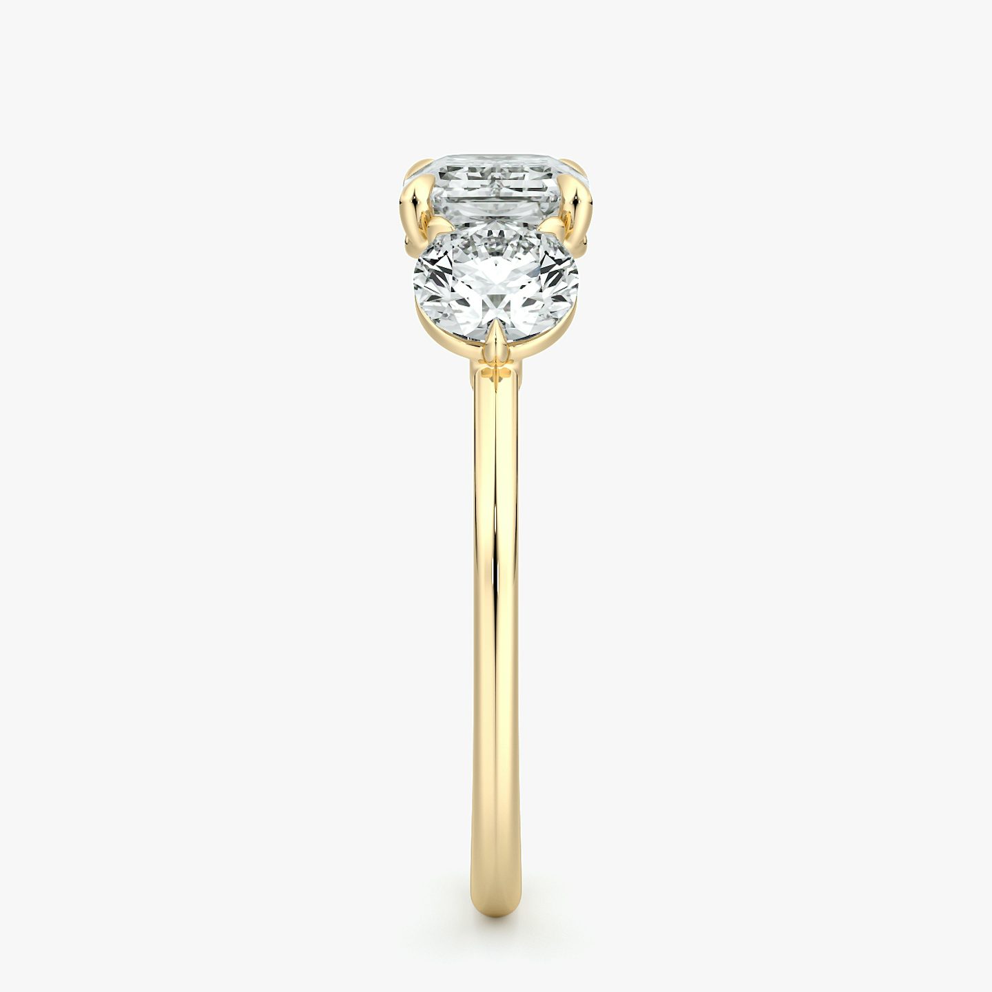 The Three Stone | Emerald | 18k | Yellow Gold | bandAccent: Plain | diamondOrientation: horizontal | sideStoneCarat: 0.50ct | sideStoneShape: Round Brilliant | caratWeight: other