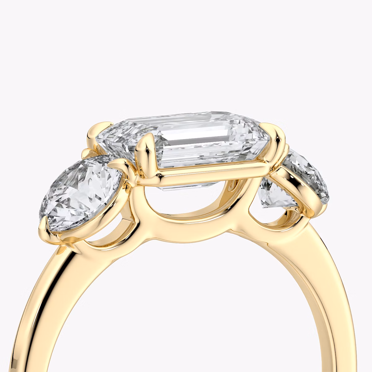 The Three Stone | Emerald | 18k | Yellow Gold | bandAccent: Plain | diamondOrientation: horizontal | sideStoneCarat: 0.50ct | sideStoneShape: Round Brilliant | caratWeight: other