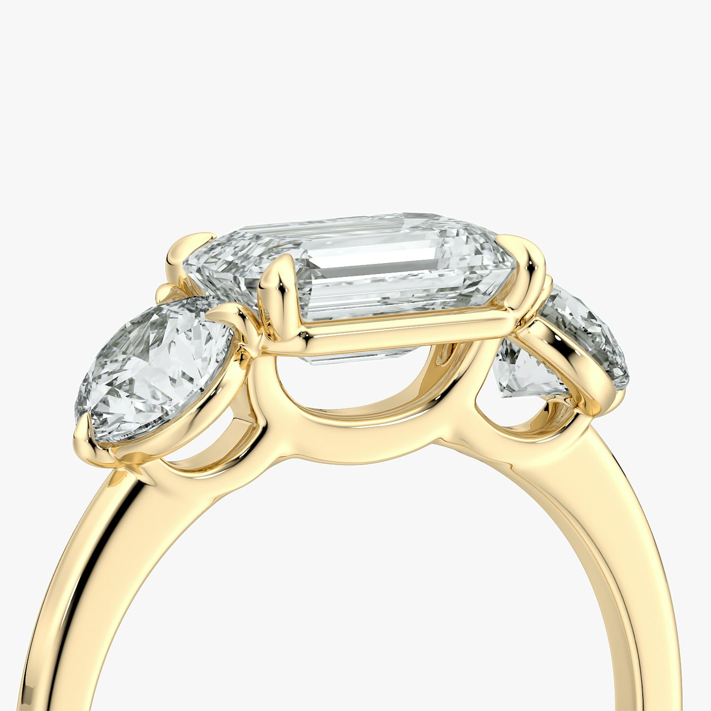 The Three Stone | Emerald | 18k | Yellow Gold | bandAccent: Plain | diamondOrientation: horizontal | sideStoneCarat: 0.50ct | sideStoneShape: Round Brilliant | caratWeight: other