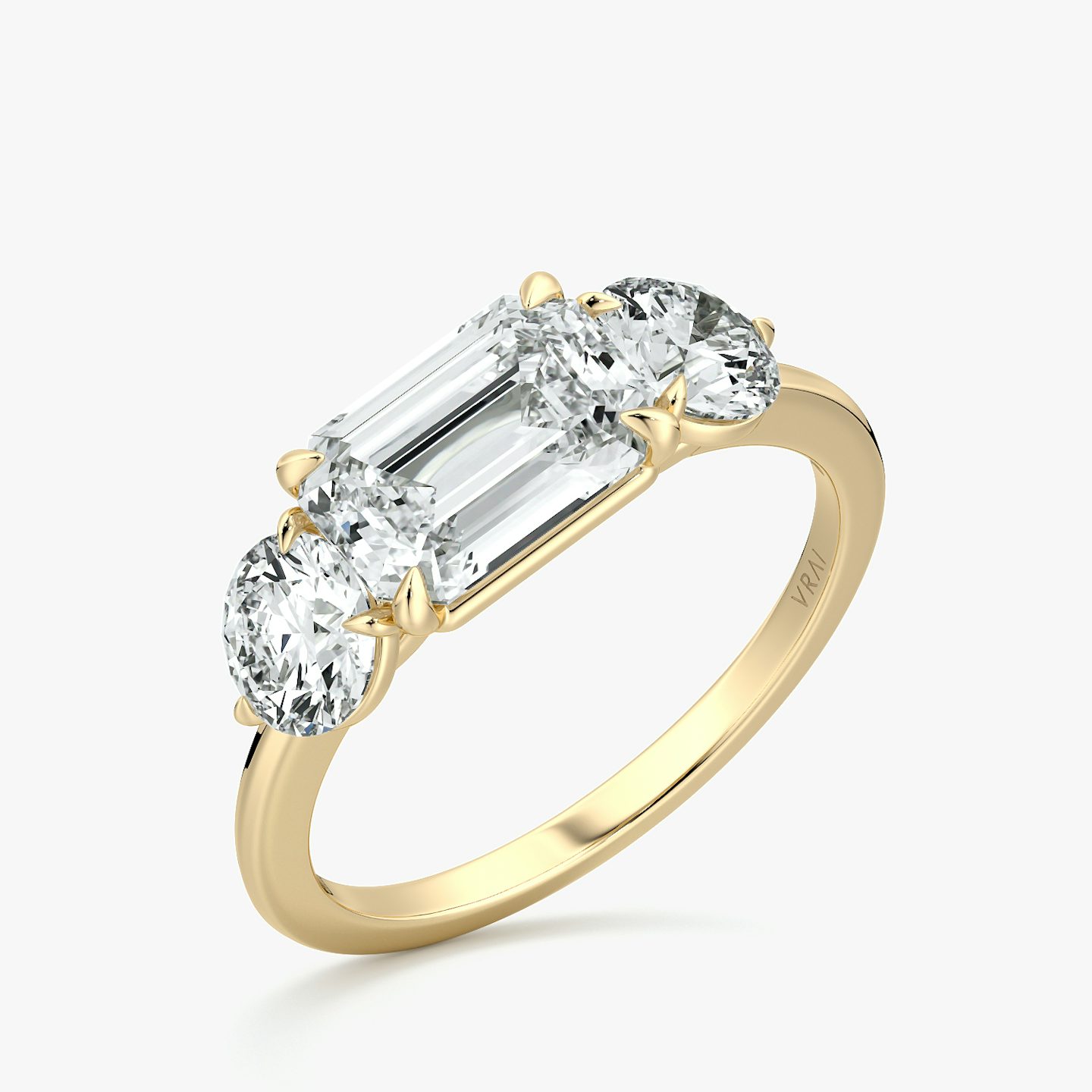 The Three Stone | Emerald | 18k | Yellow Gold | bandAccent: Plain | diamondOrientation: horizontal | sideStoneCarat: 0.50ct | sideStoneShape: Round Brilliant | caratWeight: other