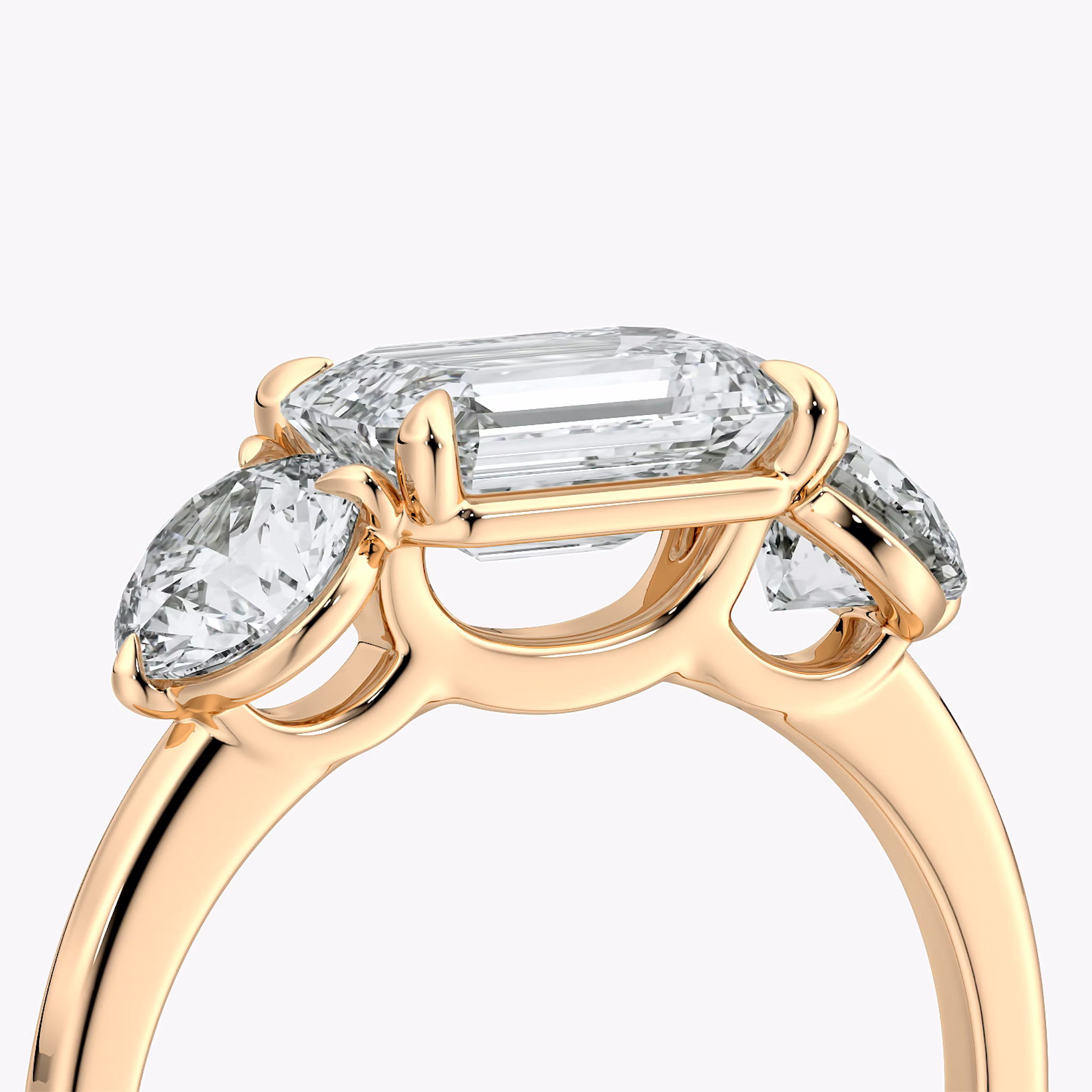 The Three Stone | Emerald | 14k | Rose Gold | bandAccent: Plain | diamondOrientation: horizontal | sideStoneCarat: 0.50ct | sideStoneShape: Round Brilliant | caratWeight: other