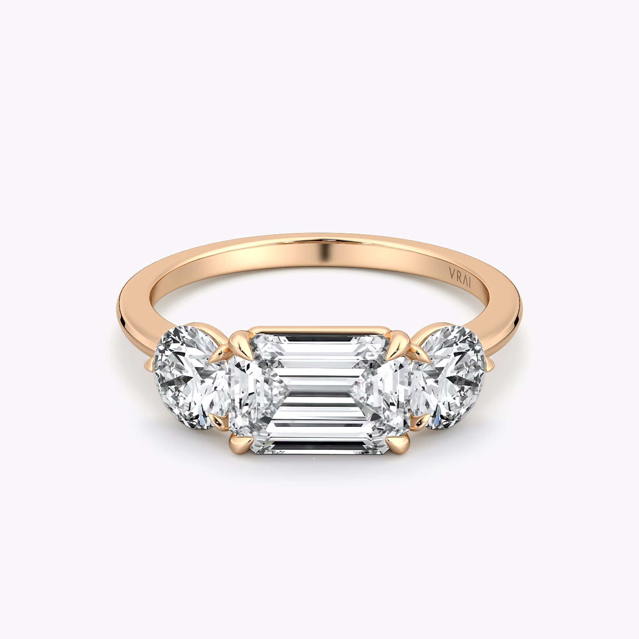 The Three Stone | Emerald | 14k | Rose Gold | bandAccent: Plain | diamondOrientation: horizontal | sideStoneCarat: 0.50ct | sideStoneShape: Round Brilliant | caratWeight: other