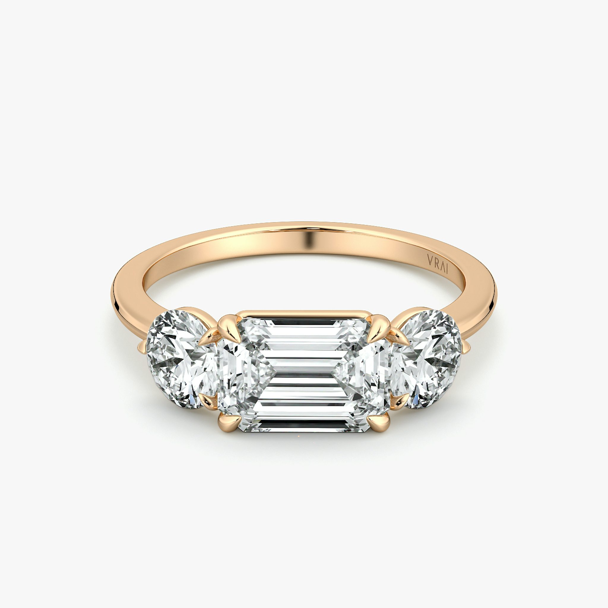 The Three Stone | Emerald | 14k | Rose Gold | bandAccent: Plain | diamondOrientation: horizontal | sideStoneCarat: 0.50ct | sideStoneShape: Round Brilliant | caratWeight: other