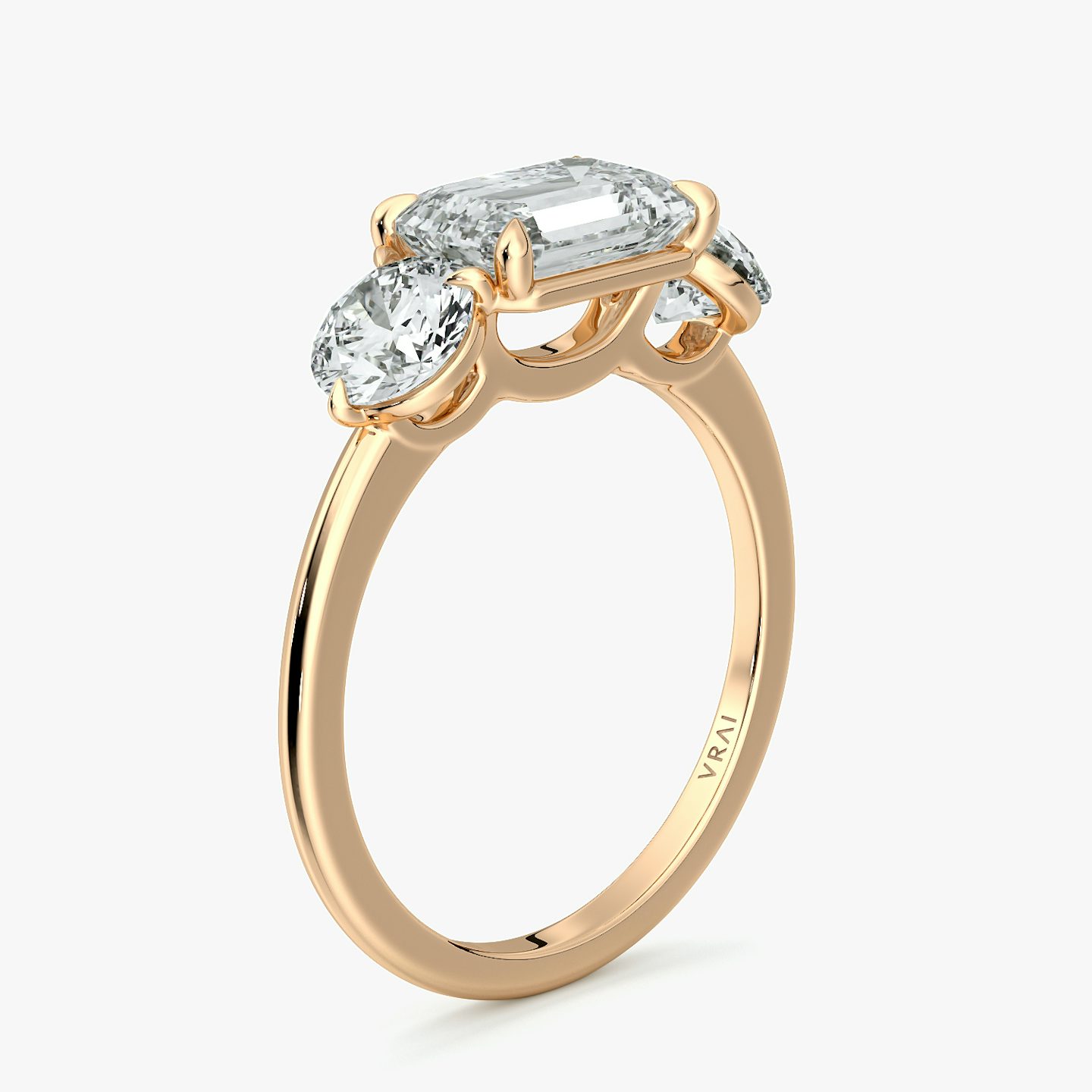 The Three Stone | Emerald | 14k | Rose Gold | bandAccent: Plain | diamondOrientation: horizontal | sideStoneCarat: 0.50ct | sideStoneShape: Round Brilliant | caratWeight: other