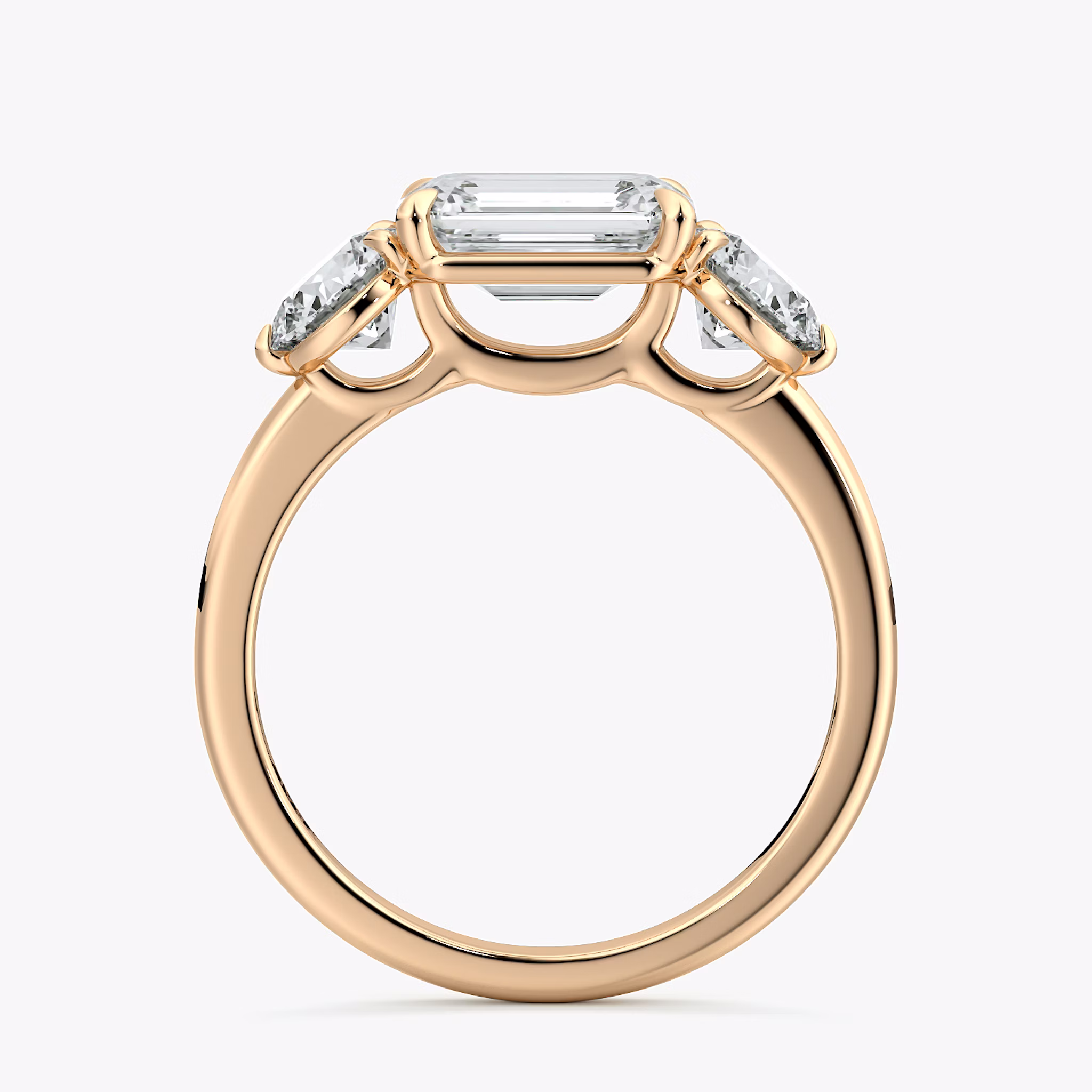 The Three Stone | Emerald | 14k | Rose Gold | bandAccent: Plain | diamondOrientation: horizontal | sideStoneCarat: 0.50ct | sideStoneShape: Round Brilliant | caratWeight: other