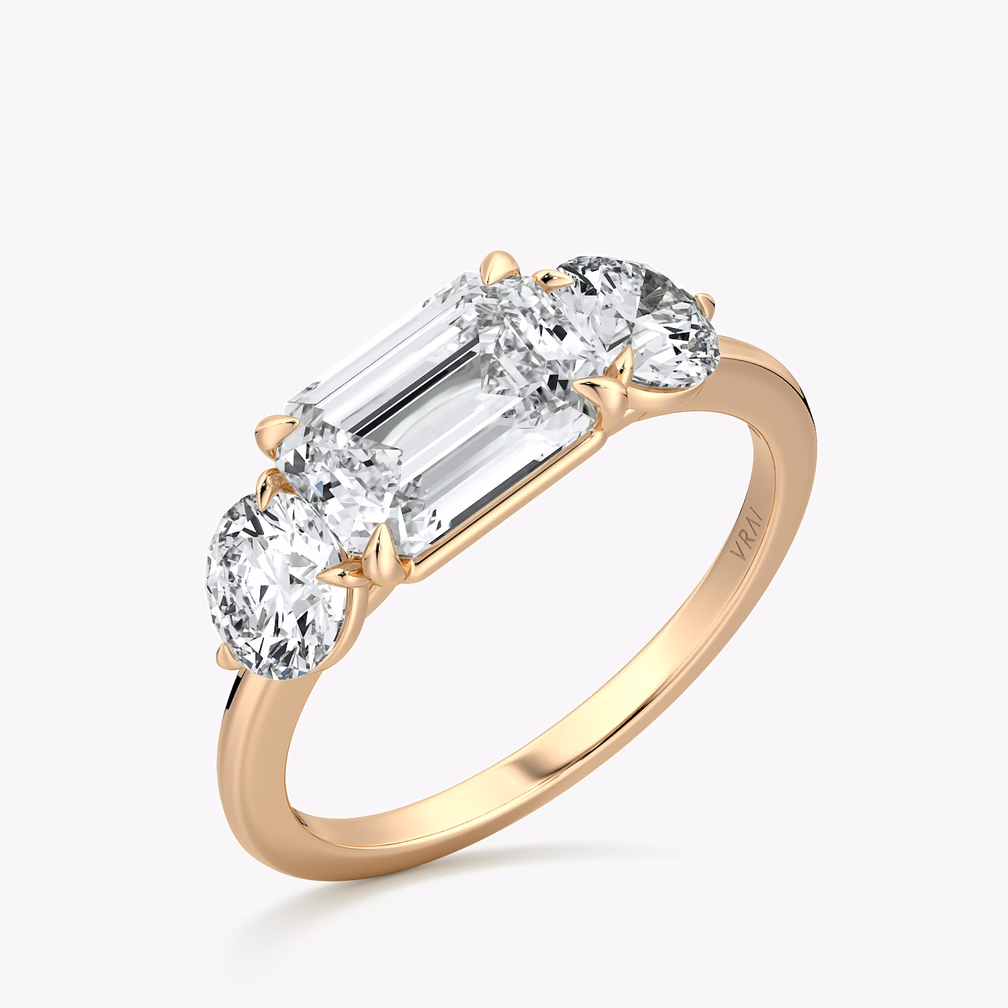 The Three Stone | Emerald | 14k | Rose Gold | bandAccent: Plain | diamondOrientation: horizontal | sideStoneCarat: 0.50ct | sideStoneShape: Round Brilliant | caratWeight: other