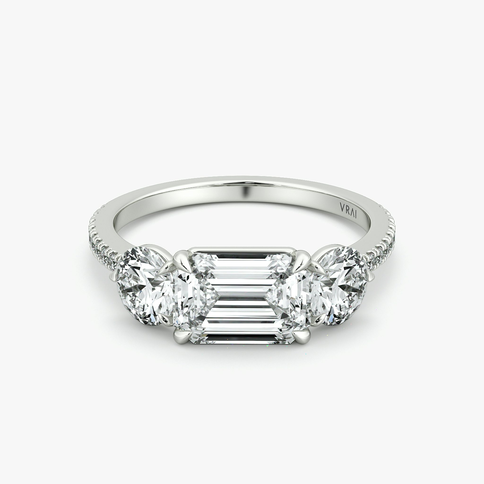 The Three Stone | Emerald | 18k | White Gold | bandAccent: Pavé | diamondOrientation: horizontal | sideStoneCarat: 0.50ct | sideStoneShape: Round Brilliant | caratWeight: other