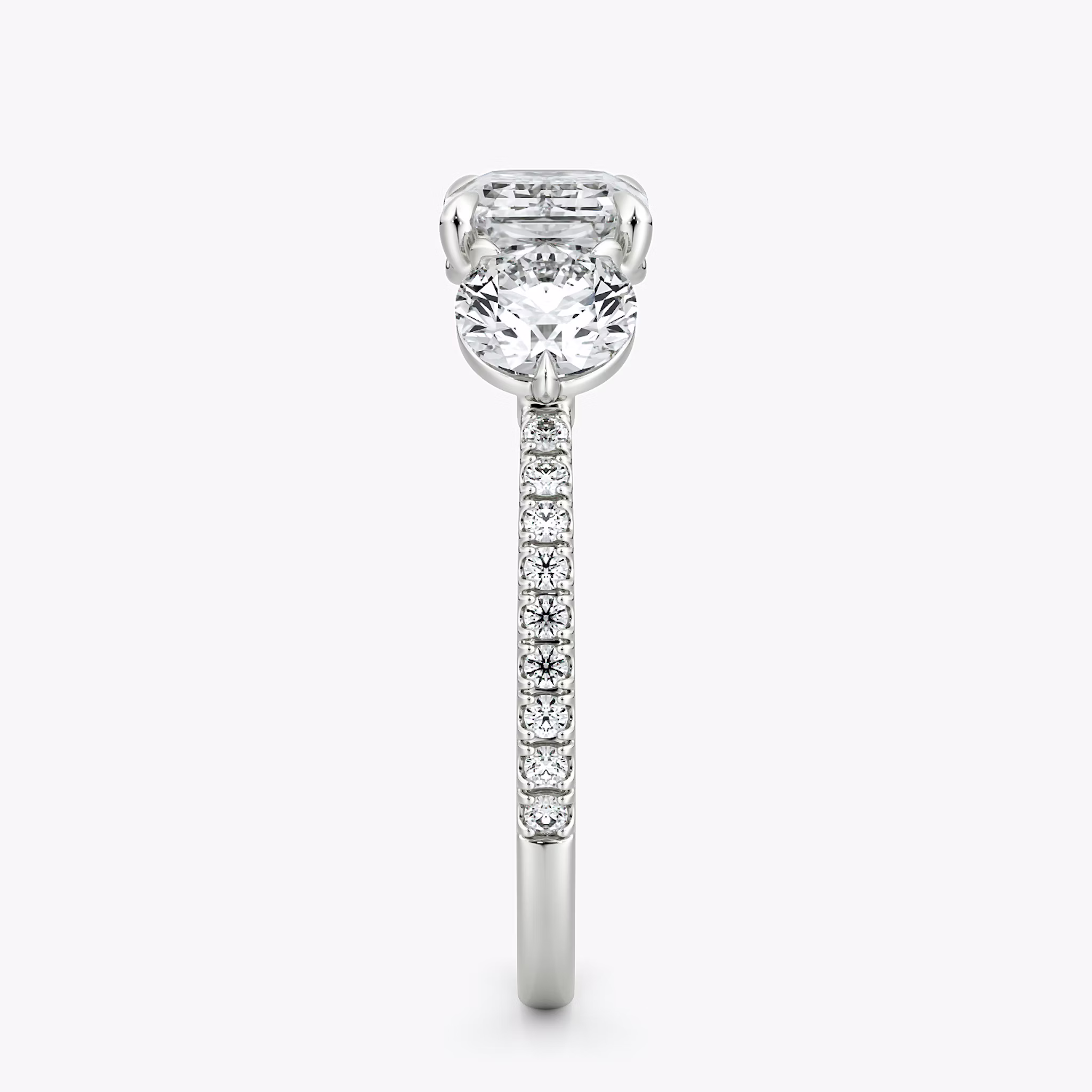 The Three Stone | Emerald | 18k | White Gold | bandAccent: Pavé | diamondOrientation: horizontal | sideStoneCarat: 0.50ct | sideStoneShape: Round Brilliant | caratWeight: other