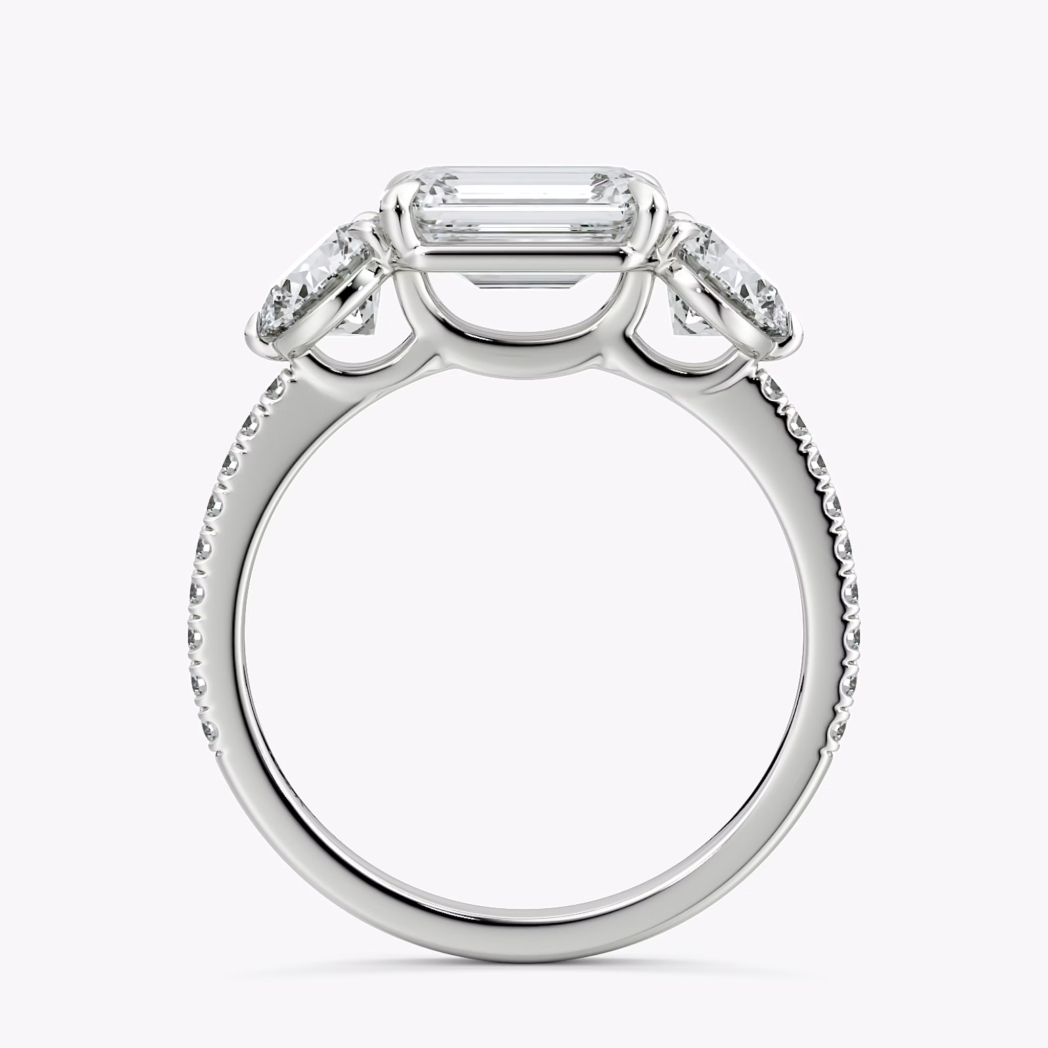 The Three Stone | Emerald | 18k | White Gold | bandAccent: Pavé | diamondOrientation: horizontal | sideStoneCarat: 0.50ct | sideStoneShape: Round Brilliant | caratWeight: other