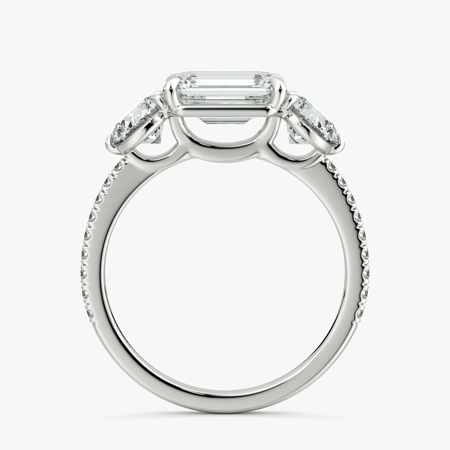 The Three Stone | Emerald | Platinum | bandAccent: Pavé | diamondOrientation: horizontal | sideStoneCarat: 0.50ct | sideStoneShape: Round Brilliant | caratWeight: other