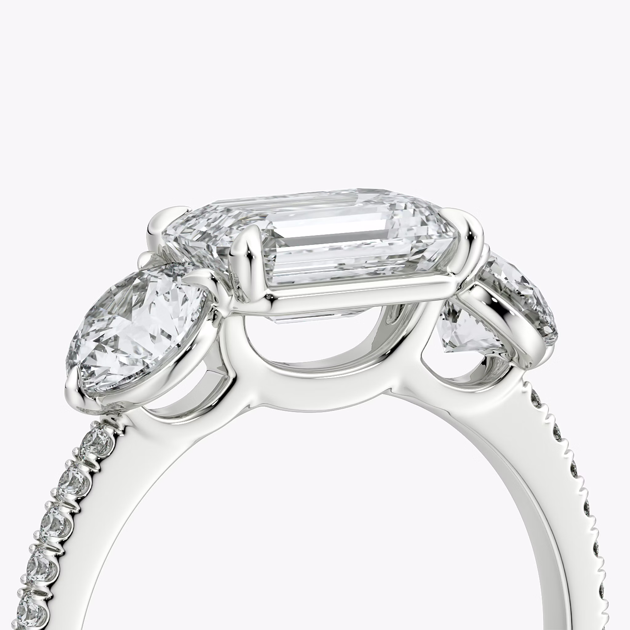 The Three Stone | Emerald | 18k | White Gold | bandAccent: Pavé | diamondOrientation: horizontal | sideStoneCarat: 0.50ct | sideStoneShape: Round Brilliant | caratWeight: other