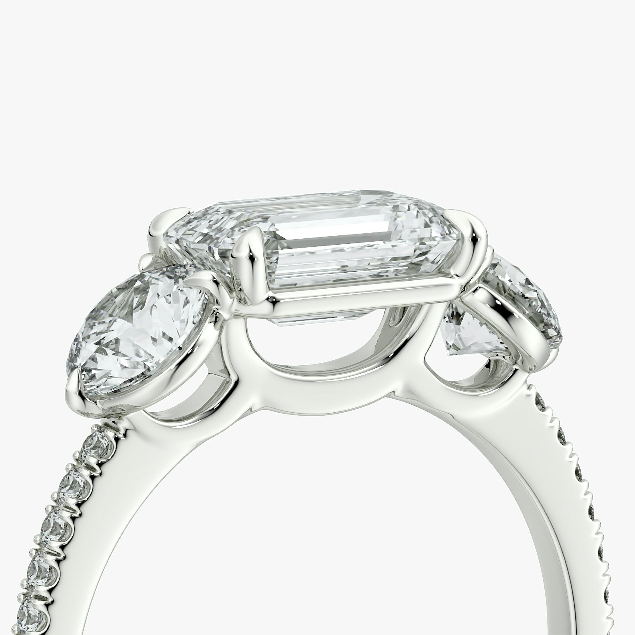 The Three Stone | Emerald | 18k | White Gold | bandAccent: Pavé | diamondOrientation: horizontal | sideStoneCarat: 0.50ct | sideStoneShape: Round Brilliant | caratWeight: other