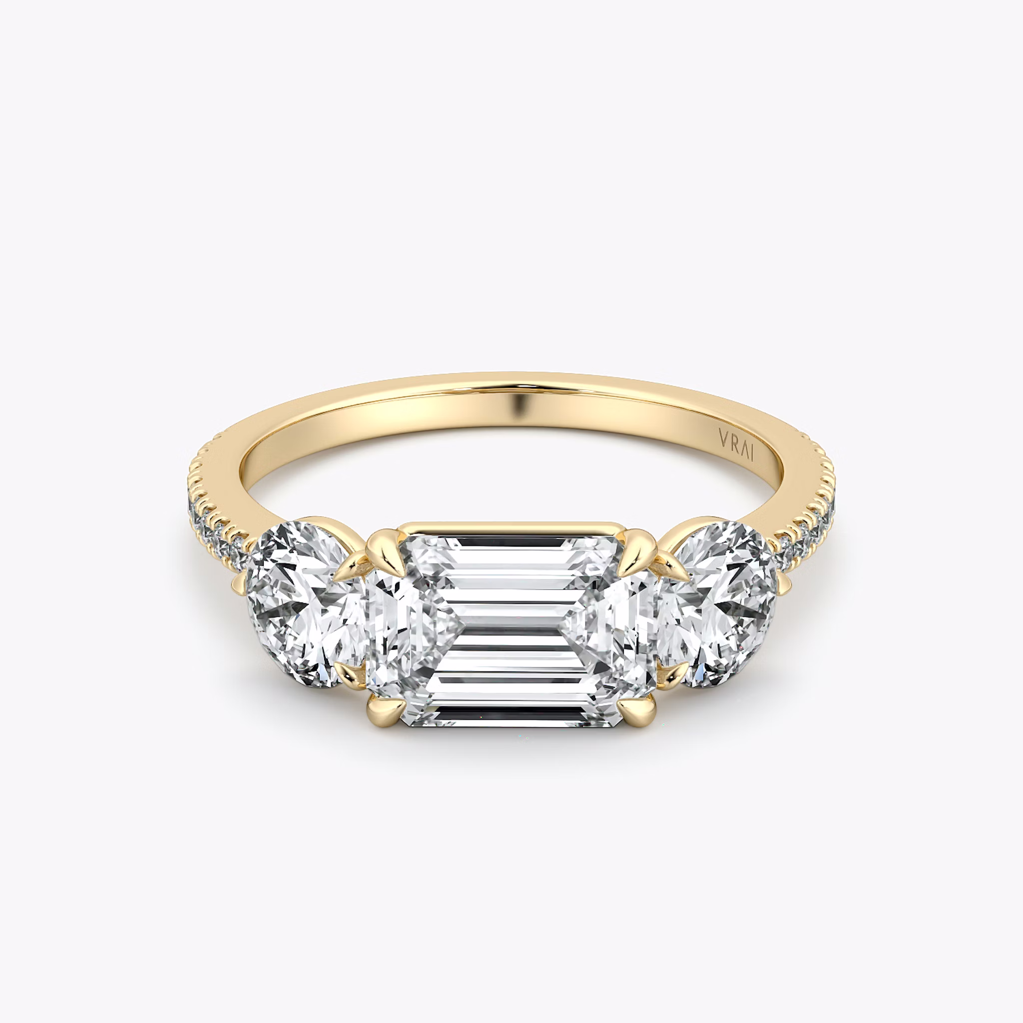 The Three Stone | Emerald | 18k | Yellow Gold | bandAccent: Pavé | diamondOrientation: horizontal | sideStoneCarat: 0.50ct | sideStoneShape: Round Brilliant | caratWeight: other