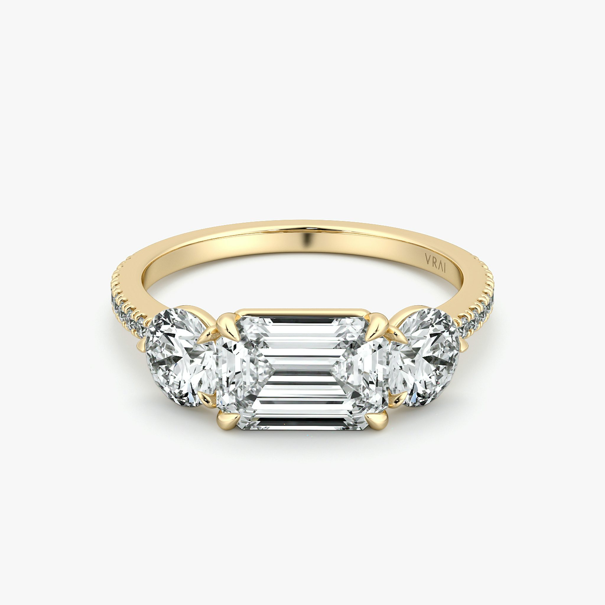 The Three Stone | Emerald | 18k | Yellow Gold | bandAccent: Pavé | diamondOrientation: horizontal | sideStoneCarat: 0.50ct | sideStoneShape: Round Brilliant | caratWeight: other