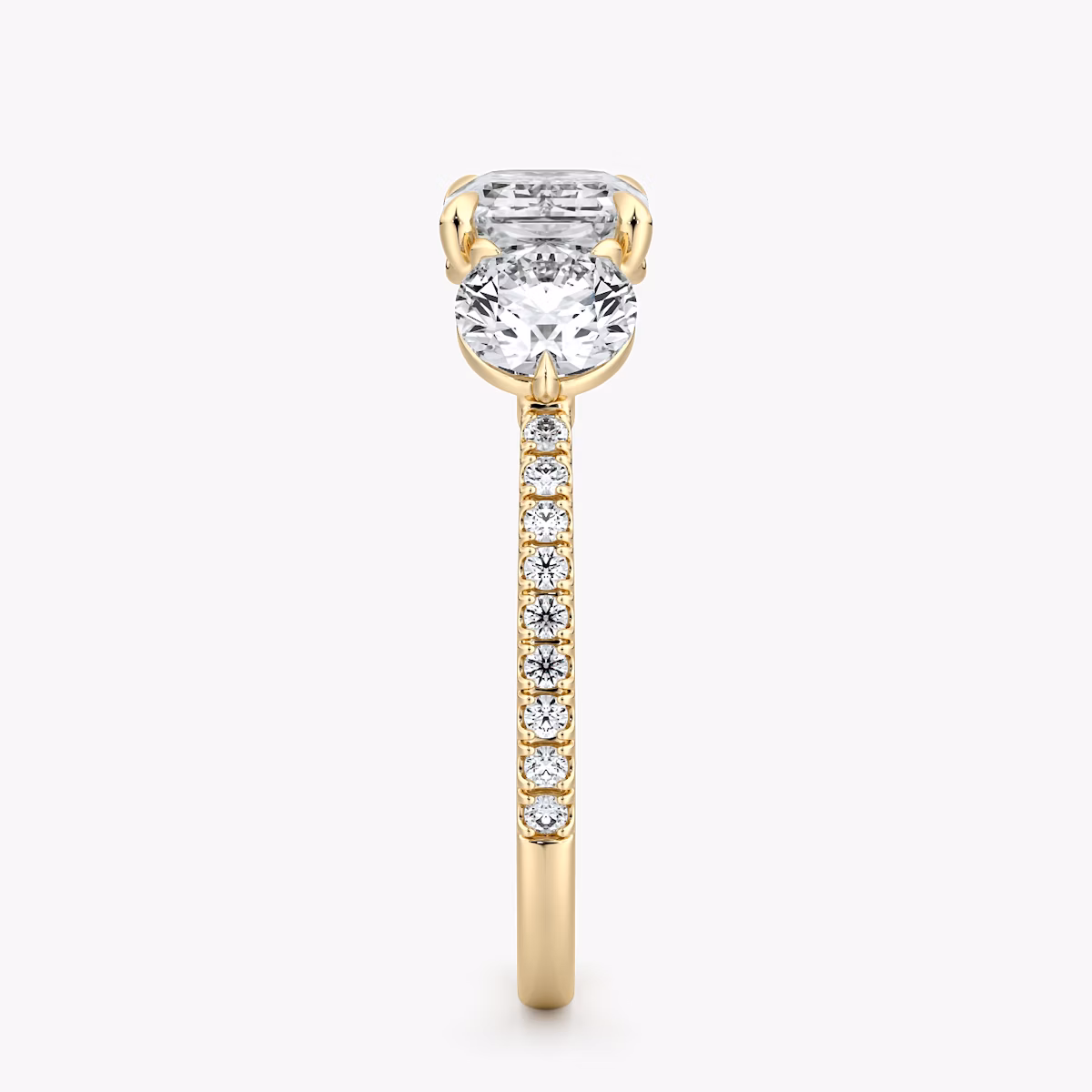 The Three Stone | Emerald | 18k | Yellow Gold | bandAccent: Pavé | diamondOrientation: horizontal | sideStoneCarat: 0.50ct | sideStoneShape: Round Brilliant | caratWeight: other