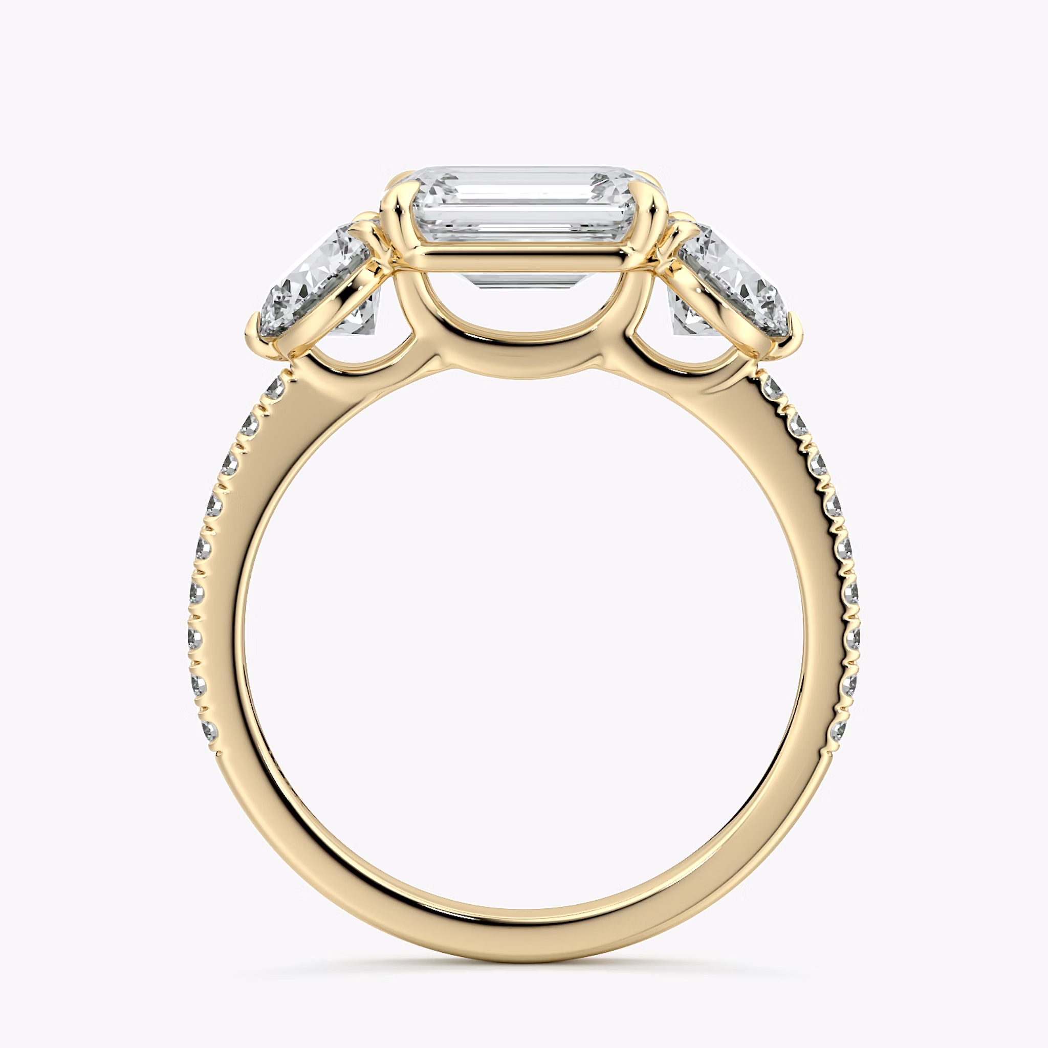 The Three Stone | Emerald | 18k | Yellow Gold | bandAccent: Pavé | diamondOrientation: horizontal | sideStoneCarat: 0.50ct | sideStoneShape: Round Brilliant | caratWeight: other