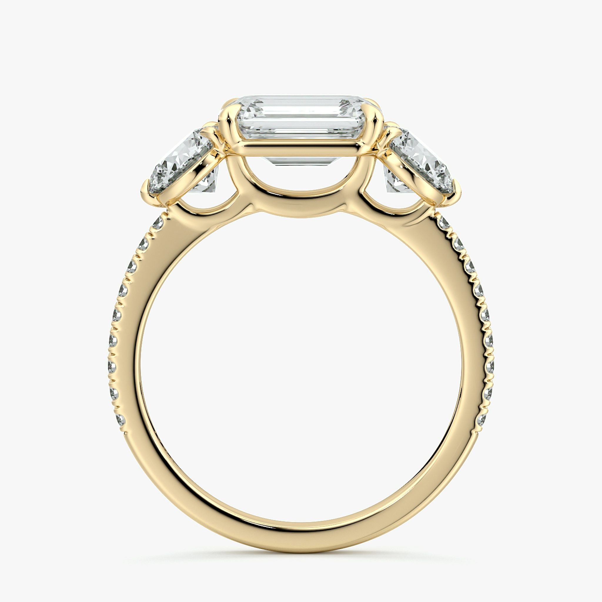 The Three Stone | Emerald | 18k | Yellow Gold | bandAccent: Pavé | diamondOrientation: horizontal | sideStoneCarat: 0.50ct | sideStoneShape: Round Brilliant | caratWeight: other