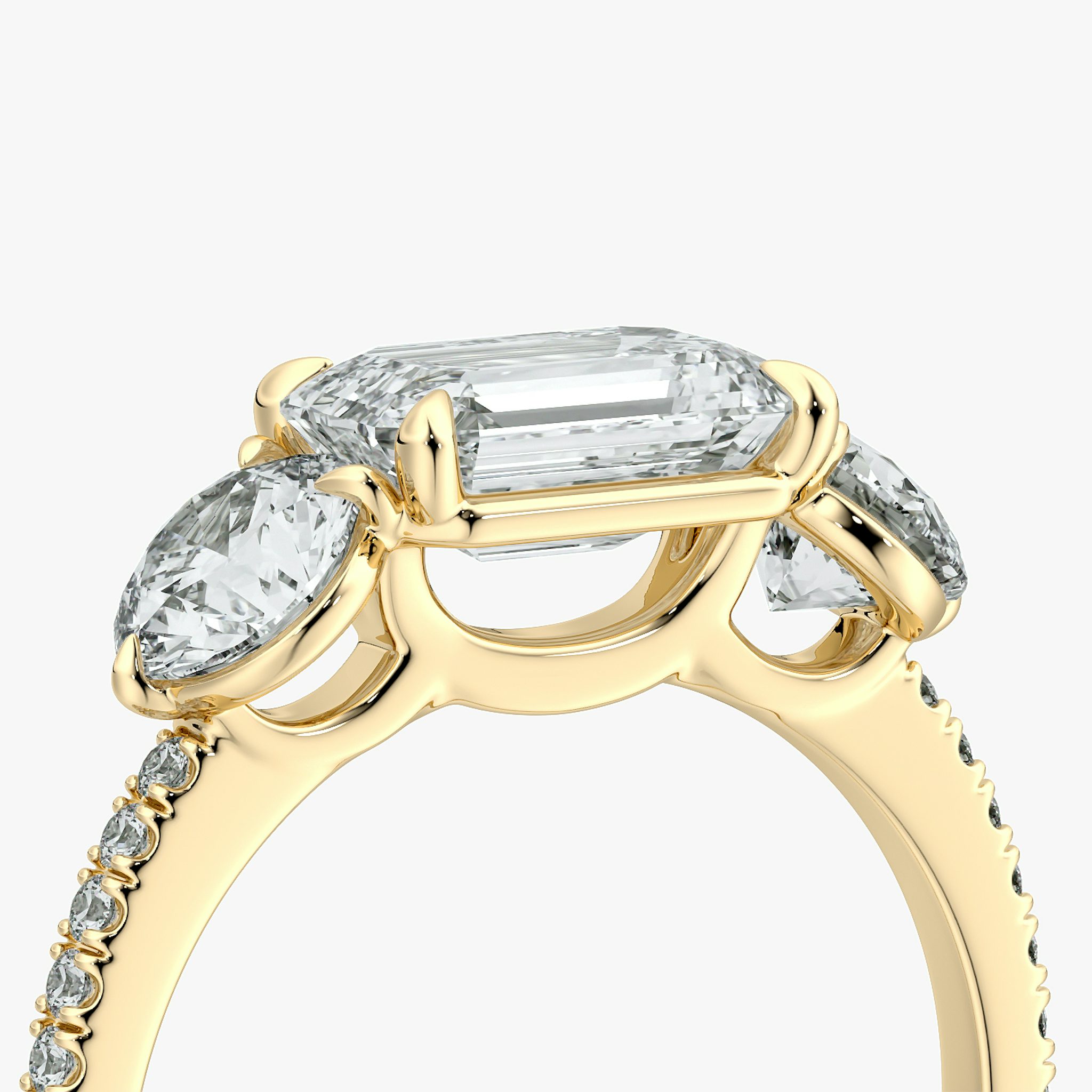 The Three Stone | Emerald | 18k | Yellow Gold | bandAccent: Pavé | diamondOrientation: horizontal | sideStoneCarat: 0.50ct | sideStoneShape: Round Brilliant | caratWeight: other