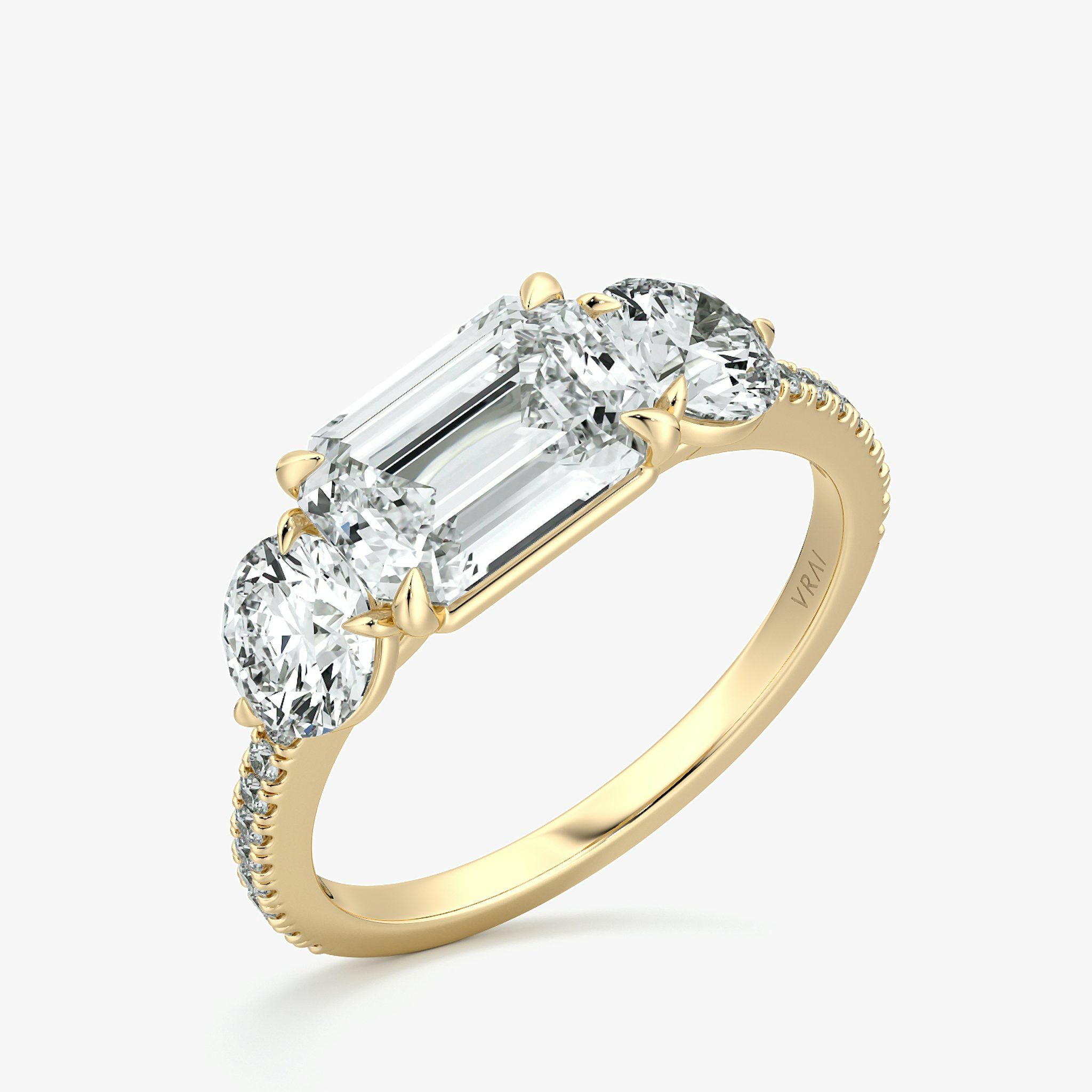 The Three Stone | Emerald | 18k | Yellow Gold | bandAccent: Pavé | diamondOrientation: horizontal | sideStoneCarat: 0.50ct | sideStoneShape: Round Brilliant | caratWeight: other