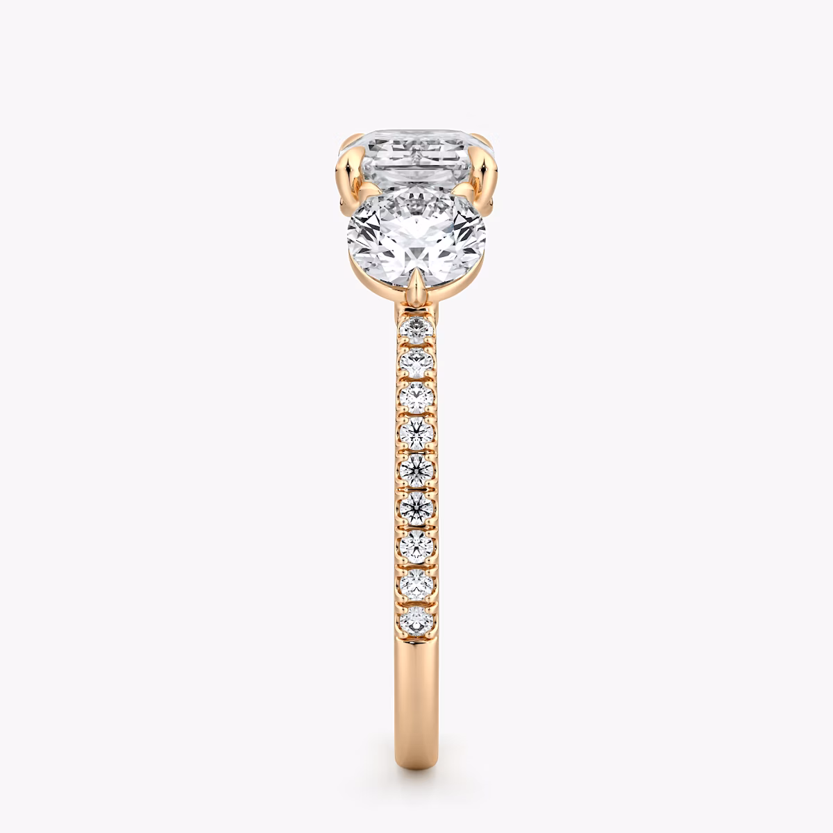 The Three Stone | Emerald | 14k | Rose Gold | bandAccent: Pavé | diamondOrientation: horizontal | sideStoneCarat: 0.50ct | sideStoneShape: Round Brilliant | caratWeight: other