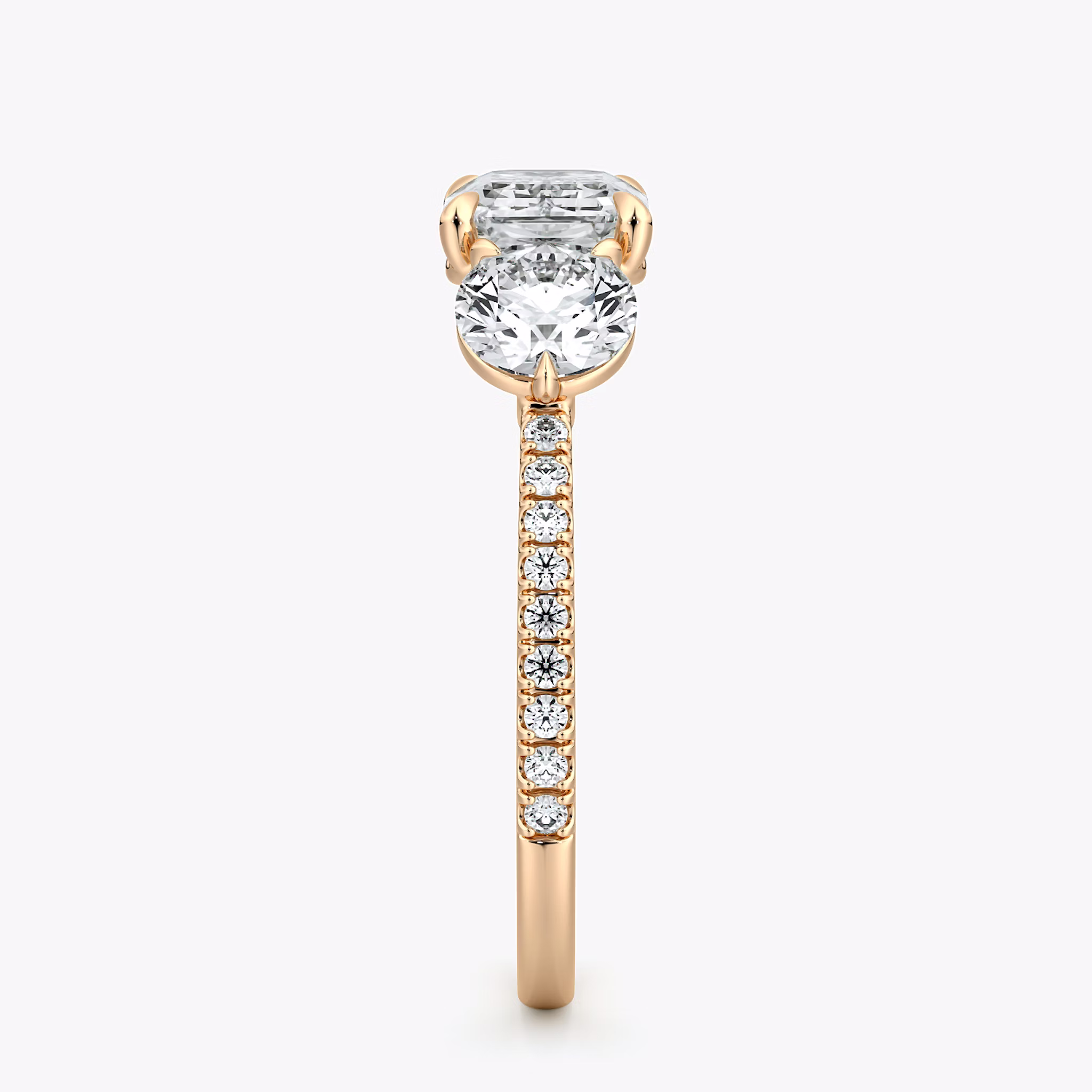 The Three Stone | Emerald | 14k | Rose Gold | bandAccent: Pavé | diamondOrientation: horizontal | sideStoneCarat: 0.50ct | sideStoneShape: Round Brilliant | caratWeight: other