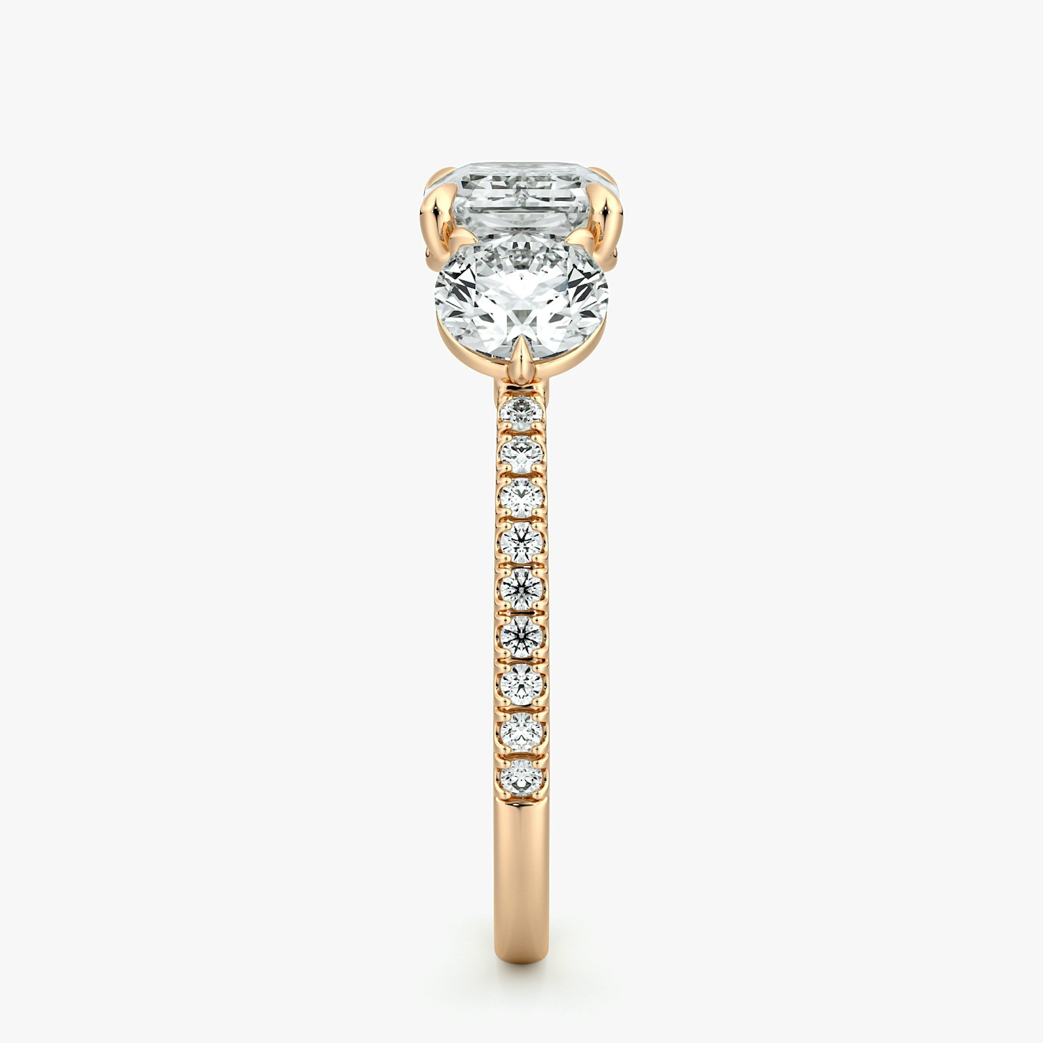 The Three Stone | Emerald | 14k | Rose Gold | bandAccent: Pavé | diamondOrientation: horizontal | sideStoneCarat: 0.50ct | sideStoneShape: Round Brilliant | caratWeight: other