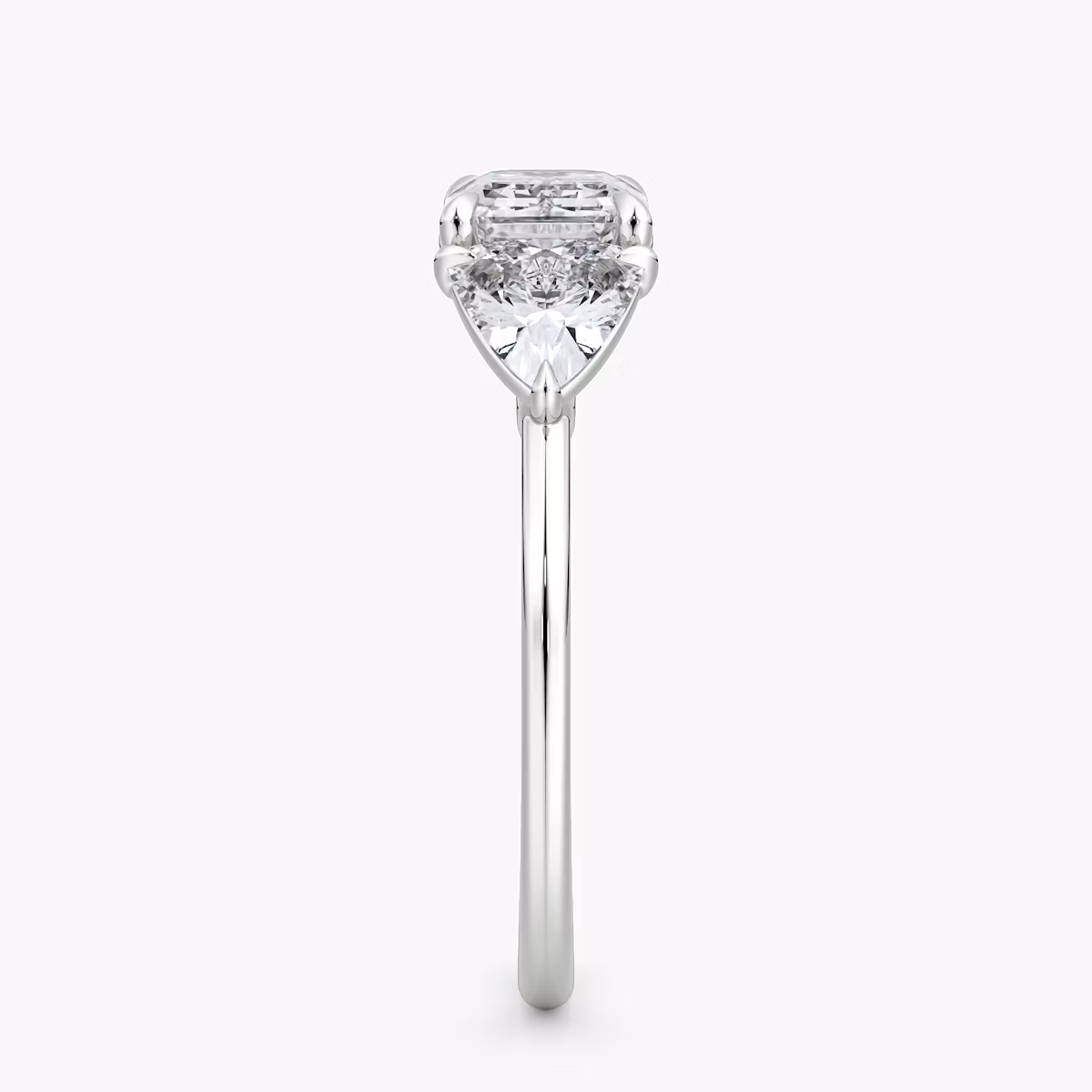 The Three Stone | Emerald | Platinum | bandAccent: Plain | diamondOrientation: horizontal | sideStoneCarat: 0.50ct | sideStoneShape: Trillion | caratWeight: other