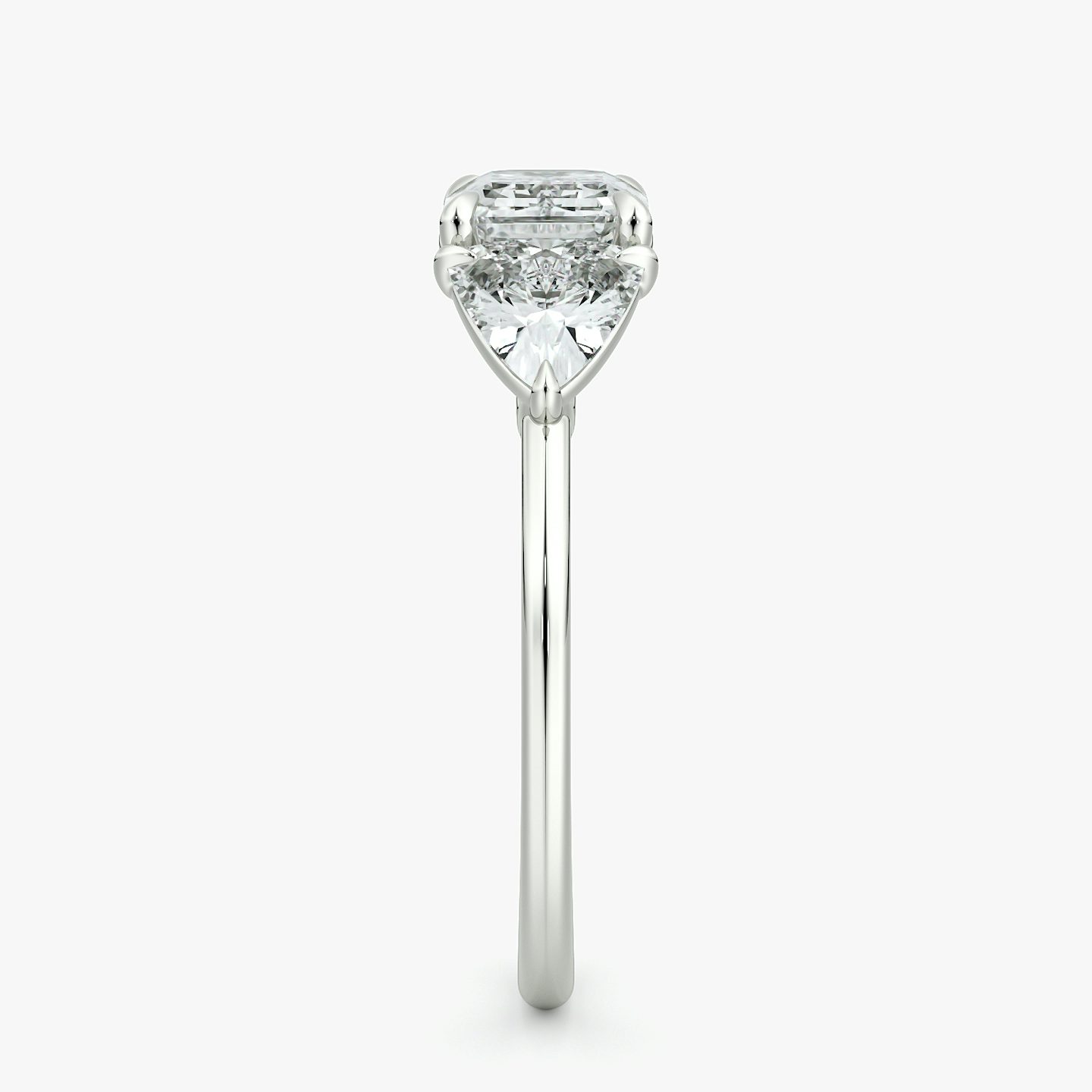 The Three Stone | Emerald | Platinum | bandAccent: Plain | diamondOrientation: horizontal | sideStoneCarat: 0.50ct | sideStoneShape: Trillion | caratWeight: other