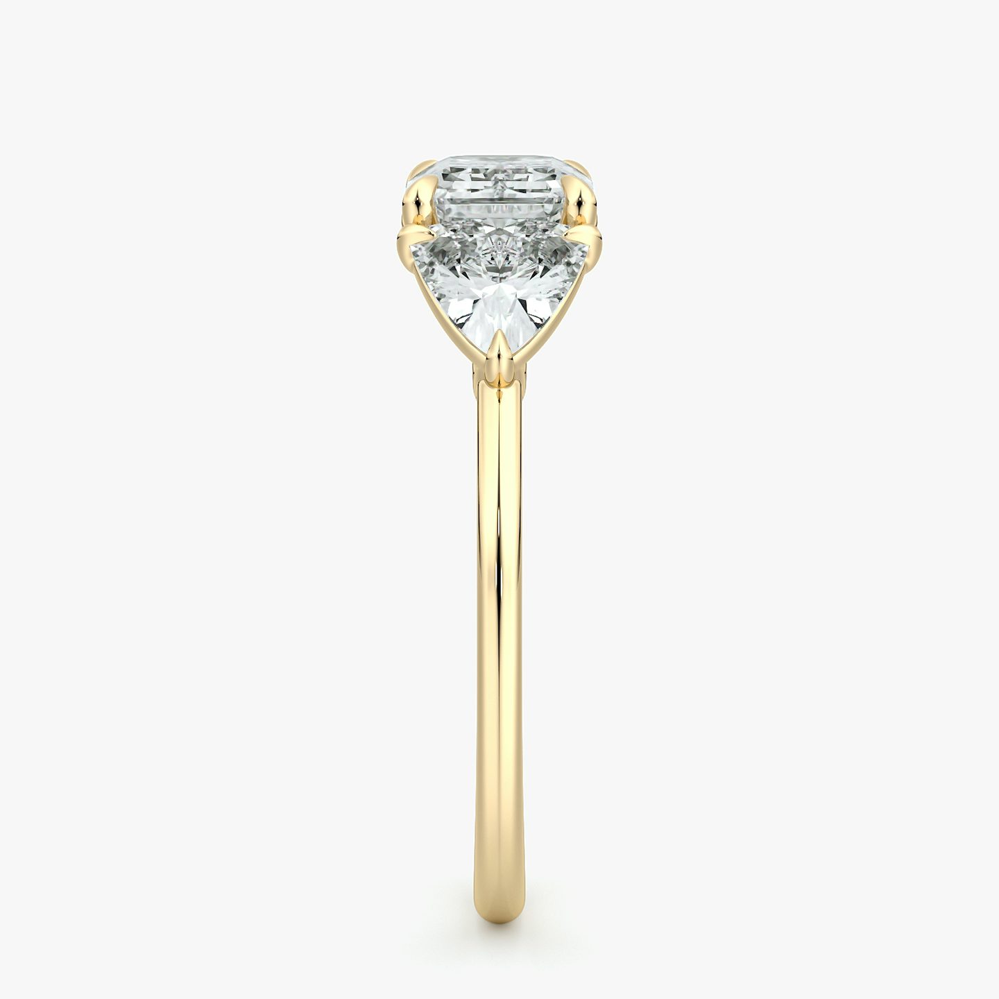 The Three Stone | Emerald | 18k | Yellow Gold | bandAccent: Plain | diamondOrientation: horizontal | sideStoneCarat: 0.50ct | sideStoneShape: Trillion | caratWeight: other