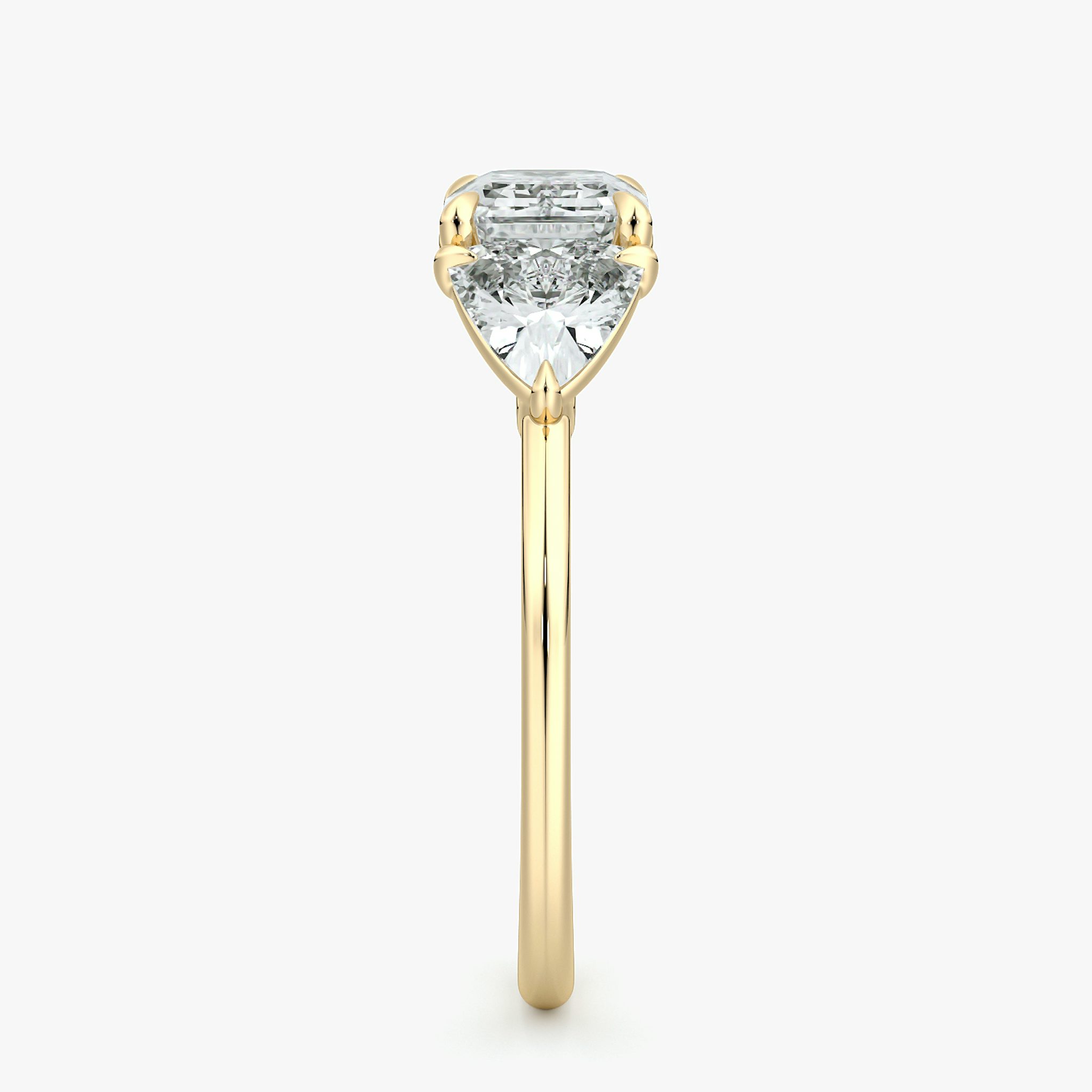 The Three Stone | Emerald | 18k | Yellow Gold | bandAccent: Plain | diamondOrientation: horizontal | sideStoneCarat: 0.50ct | sideStoneShape: Trillion | caratWeight: other