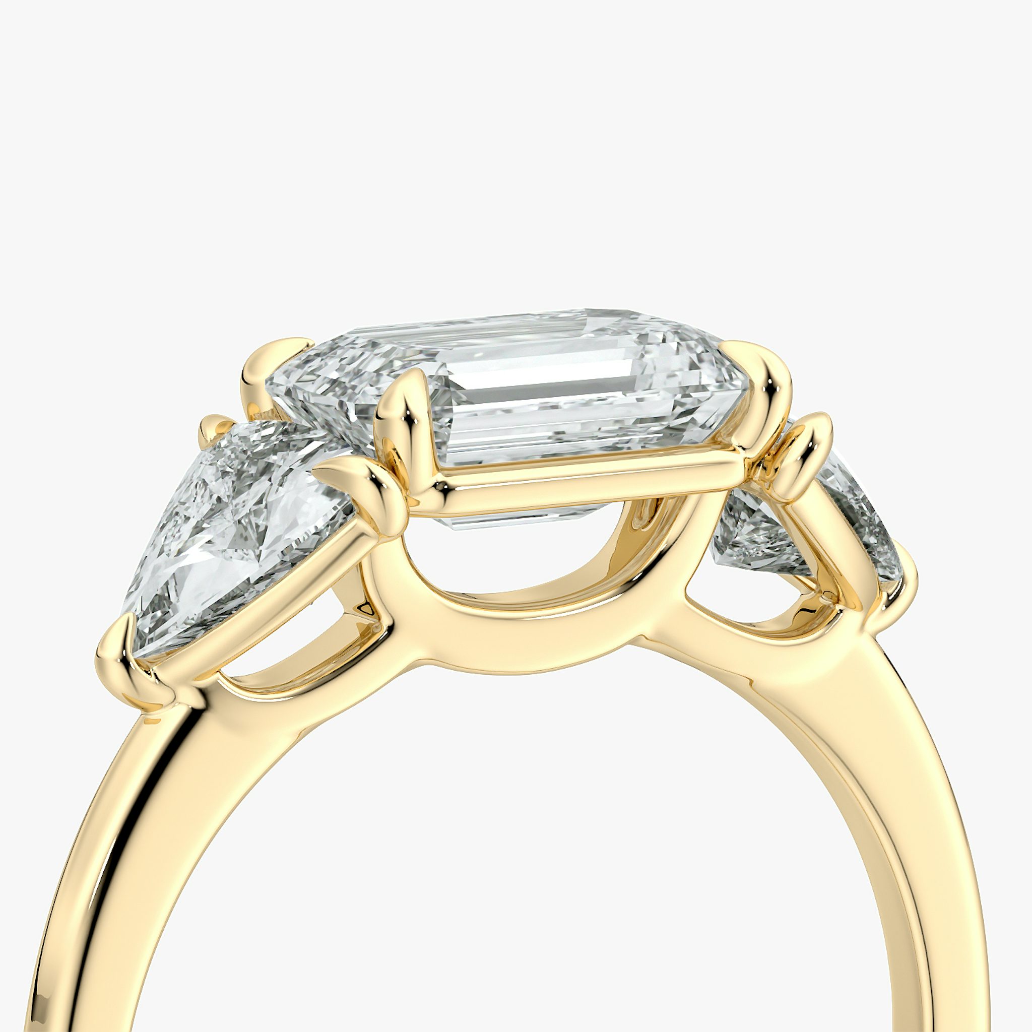 The Three Stone | Emerald | 18k | Yellow Gold | bandAccent: Plain | diamondOrientation: horizontal | sideStoneCarat: 0.50ct | sideStoneShape: Trillion | caratWeight: other