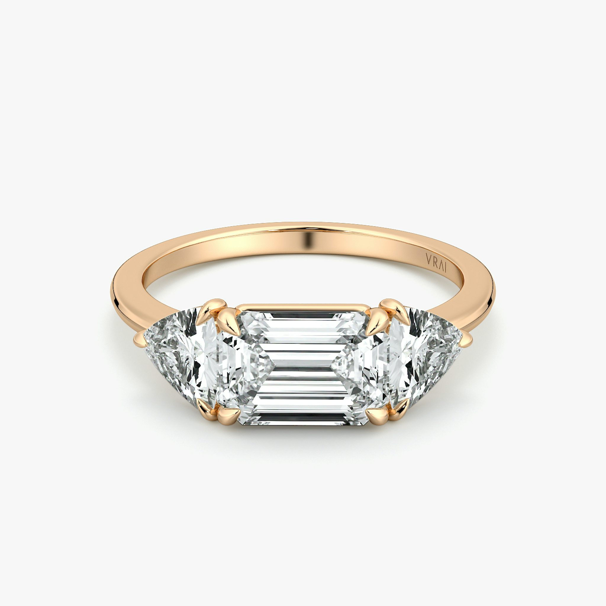 The Three Stone | Emerald | 14k | Rose Gold | bandAccent: Plain | diamondOrientation: horizontal | sideStoneCarat: 0.50ct | sideStoneShape: Trillion | caratWeight: other