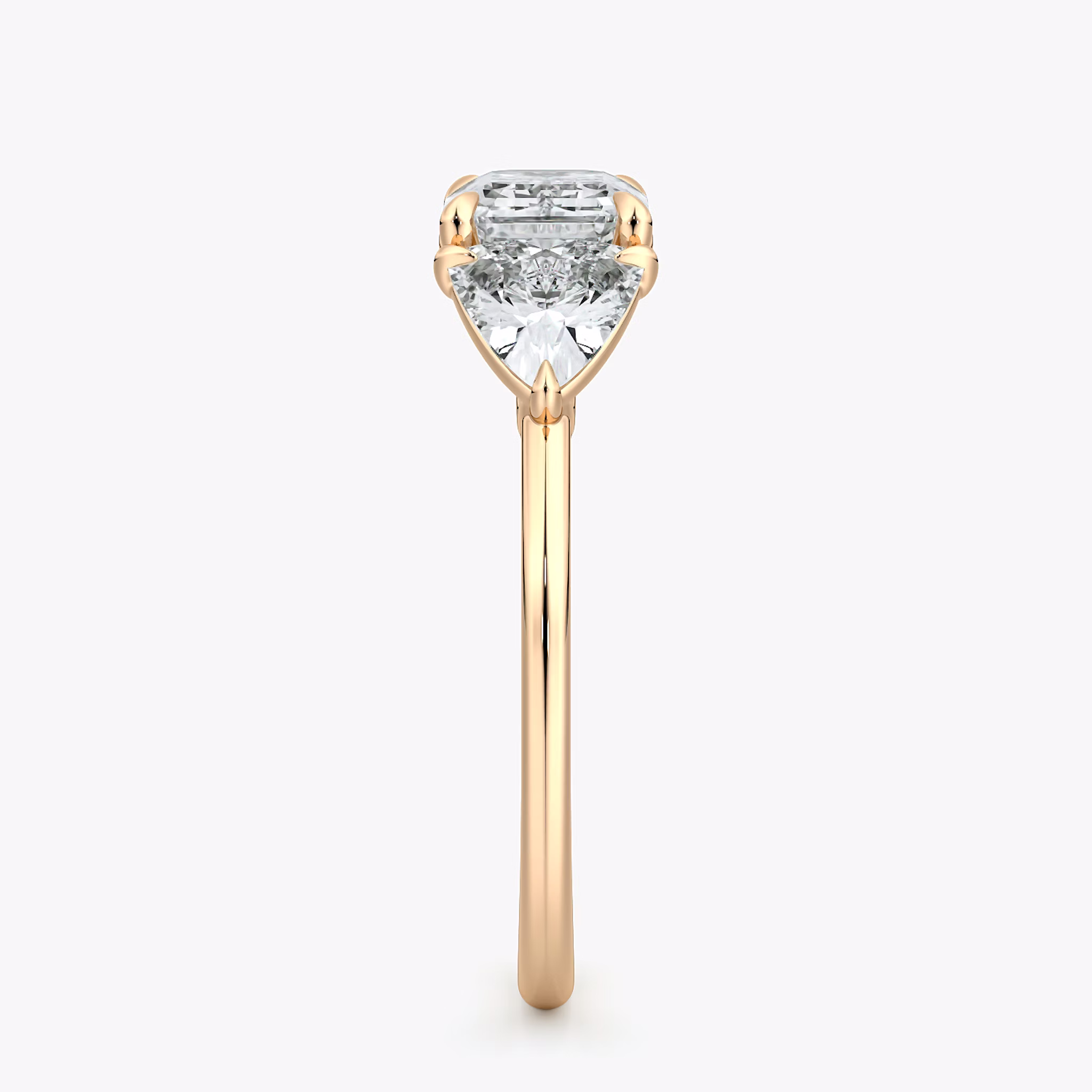 The Three Stone | Emerald | 14k | Rose Gold | bandAccent: Plain | diamondOrientation: horizontal | sideStoneCarat: 0.50ct | sideStoneShape: Trillion | caratWeight: other