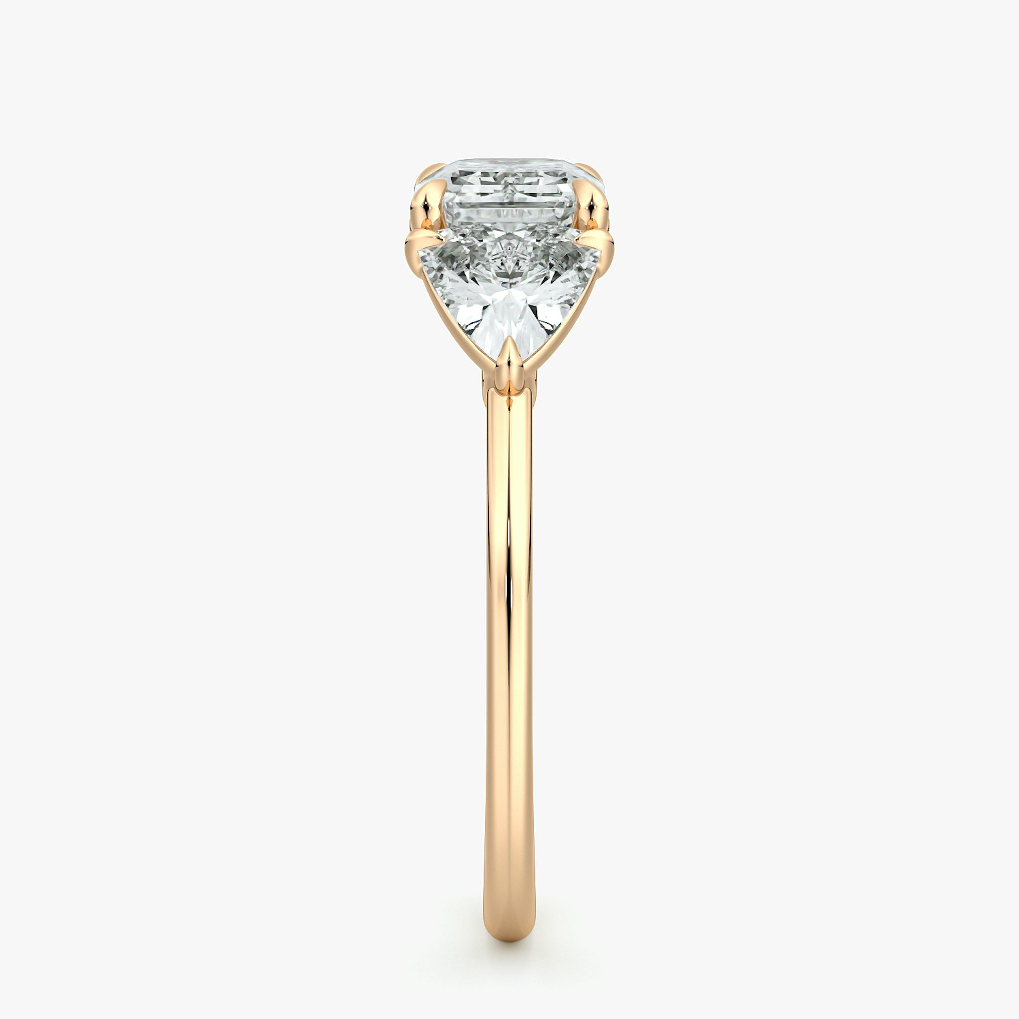 The Three Stone | Emerald | 14k | Rose Gold | bandAccent: Plain | diamondOrientation: horizontal | sideStoneCarat: 0.50ct | sideStoneShape: Trillion | caratWeight: other