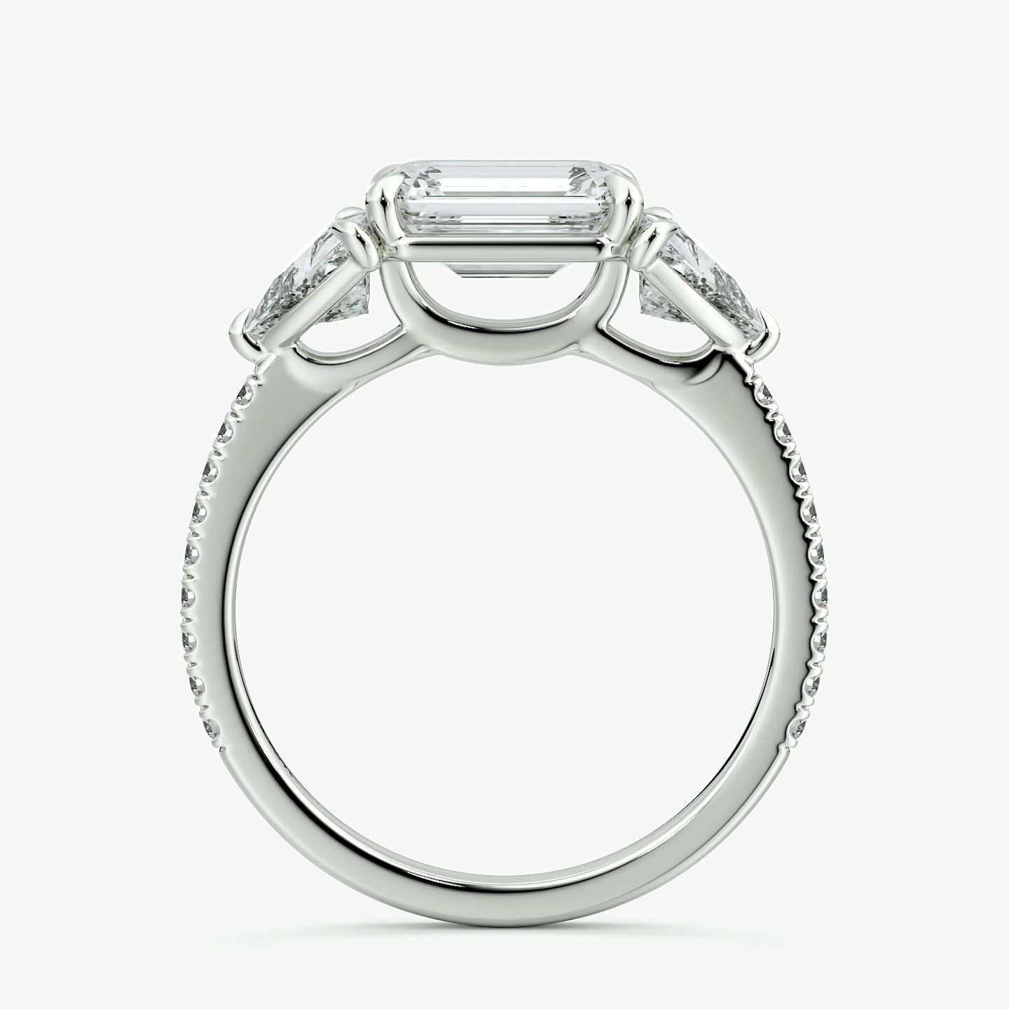 The Three Stone | Emerald | 18k | White Gold | bandAccent: Pavé | diamondOrientation: horizontal | sideStoneCarat: 0.50ct | sideStoneShape: Trillion | caratWeight: other