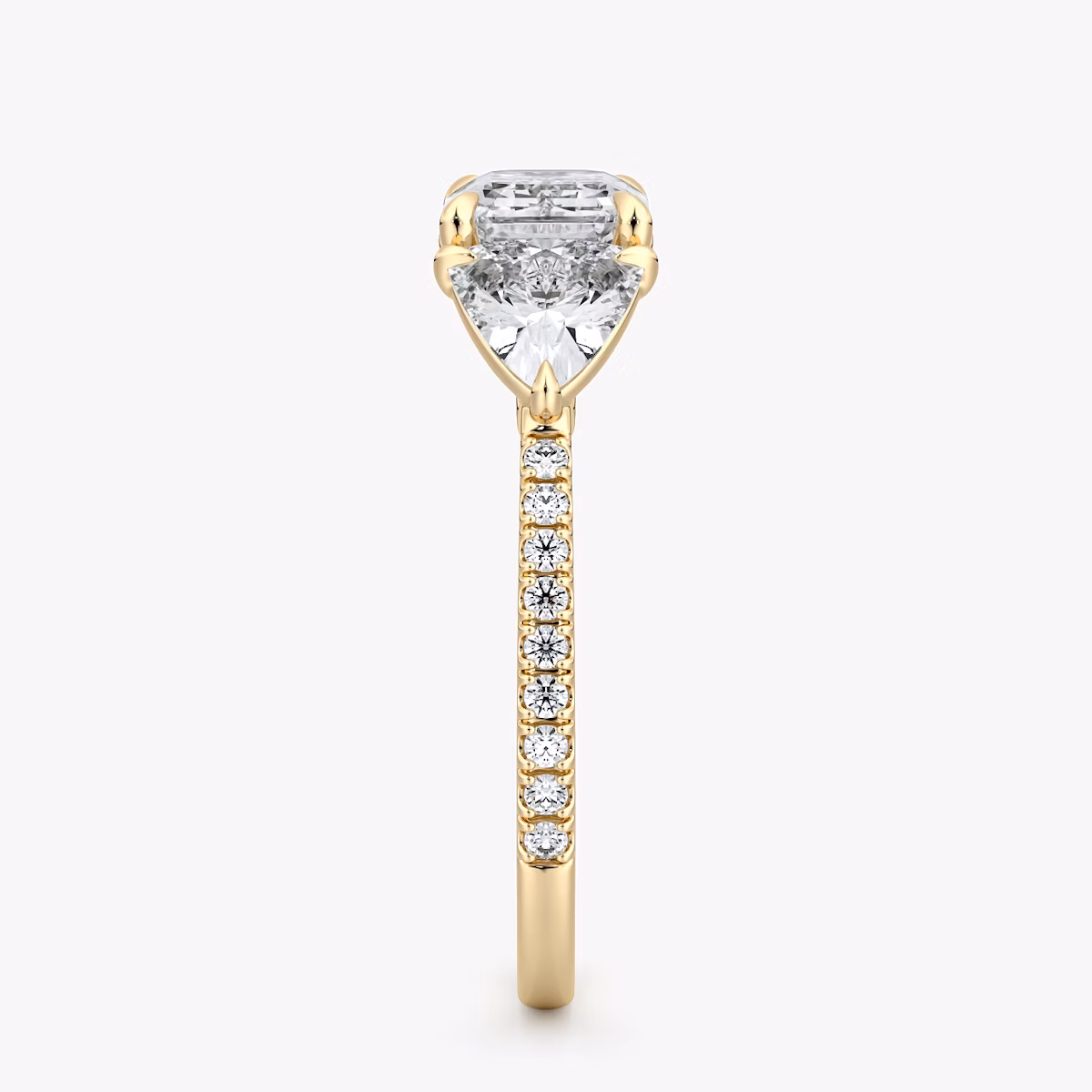The Three Stone | Emerald | 18k | Yellow Gold | bandAccent: Pavé | diamondOrientation: horizontal | sideStoneCarat: 0.50ct | sideStoneShape: Trillion | caratWeight: other