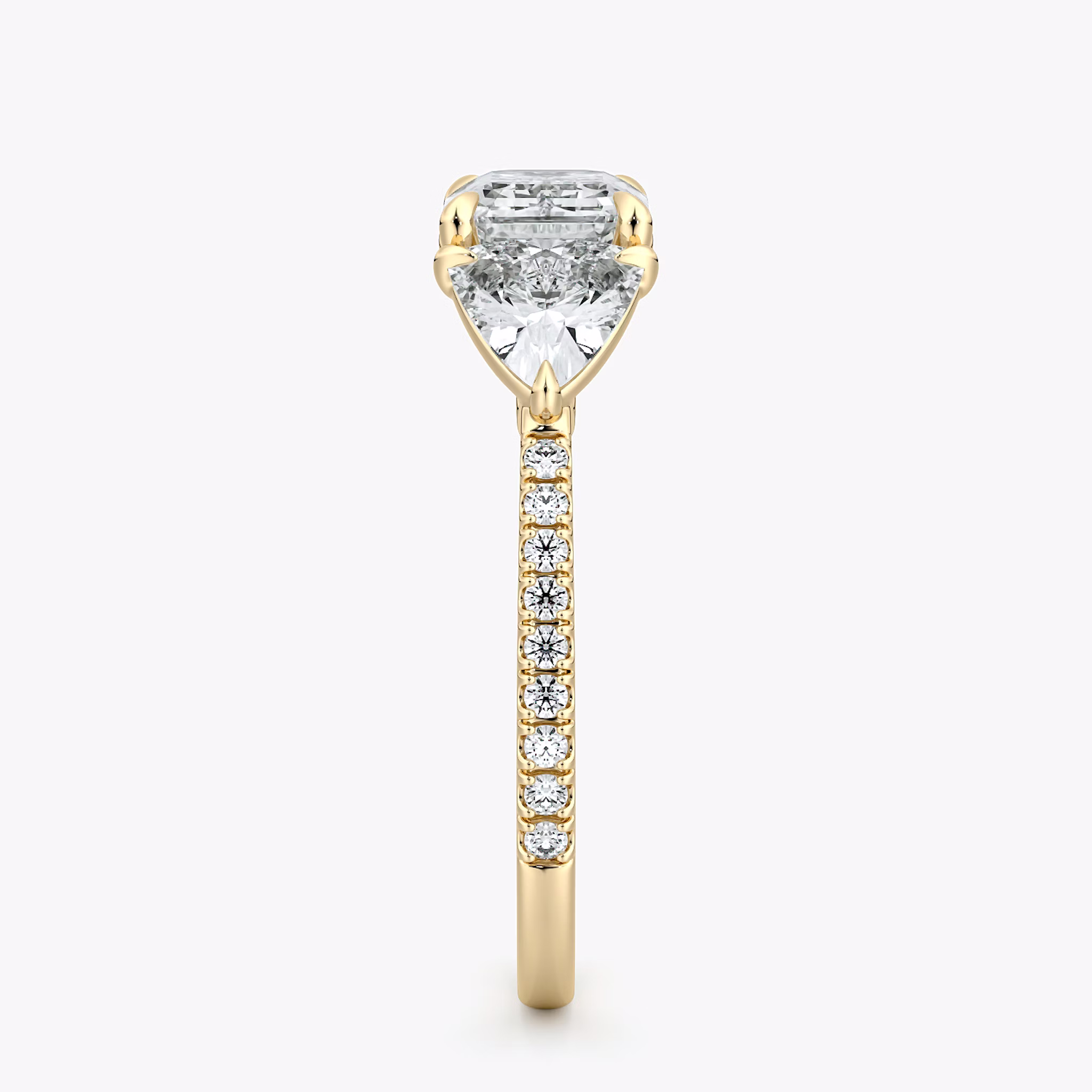 The Three Stone | Emerald | 18k | Yellow Gold | bandAccent: Pavé | diamondOrientation: horizontal | sideStoneCarat: 0.50ct | sideStoneShape: Trillion | caratWeight: other