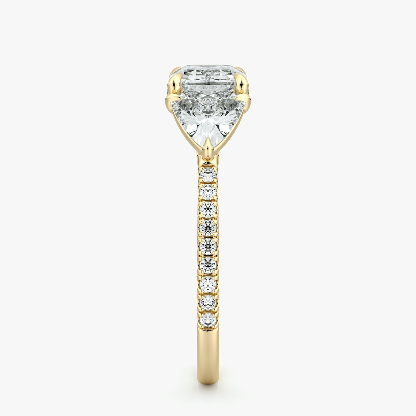 The Three Stone | Emerald | 18k | Yellow Gold | bandAccent: Pavé | diamondOrientation: horizontal | sideStoneCarat: 0.50ct | sideStoneShape: Trillion | caratWeight: other