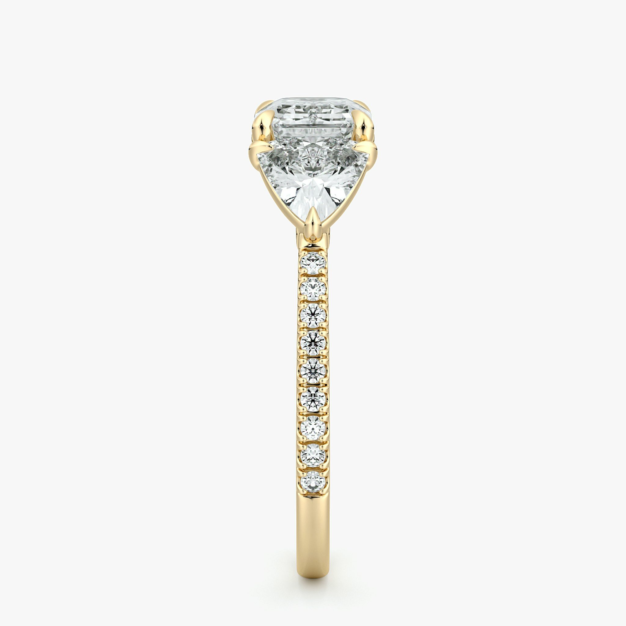 The Three Stone | Emerald | 18k | Yellow Gold | bandAccent: Pavé | diamondOrientation: horizontal | sideStoneCarat: 0.50ct | sideStoneShape: Trillion | caratWeight: other