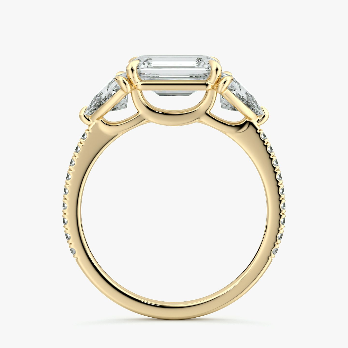 The Three Stone | Emerald | 18k | Yellow Gold | bandAccent: Pavé | diamondOrientation: horizontal | sideStoneCarat: 0.50ct | sideStoneShape: Trillion | caratWeight: other