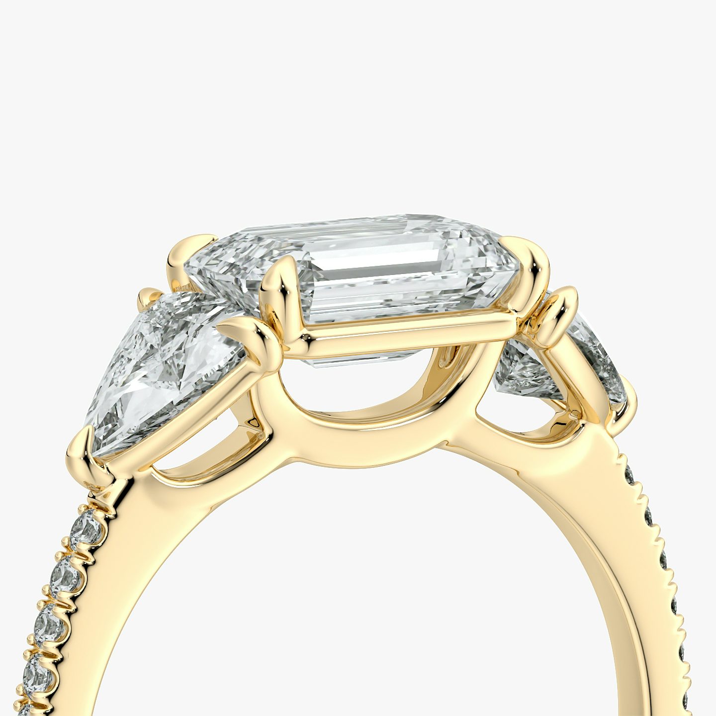 The Three Stone | Emerald | 18k | Yellow Gold | bandAccent: Pavé | diamondOrientation: horizontal | sideStoneCarat: 0.50ct | sideStoneShape: Trillion | caratWeight: other