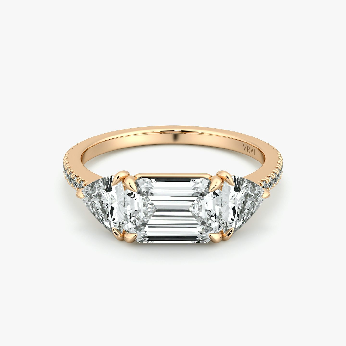 The Three Stone | Emerald | 14k | Rose Gold | bandAccent: Pavé | diamondOrientation: horizontal | sideStoneCarat: 0.50ct | sideStoneShape: Trillion | caratWeight: other
