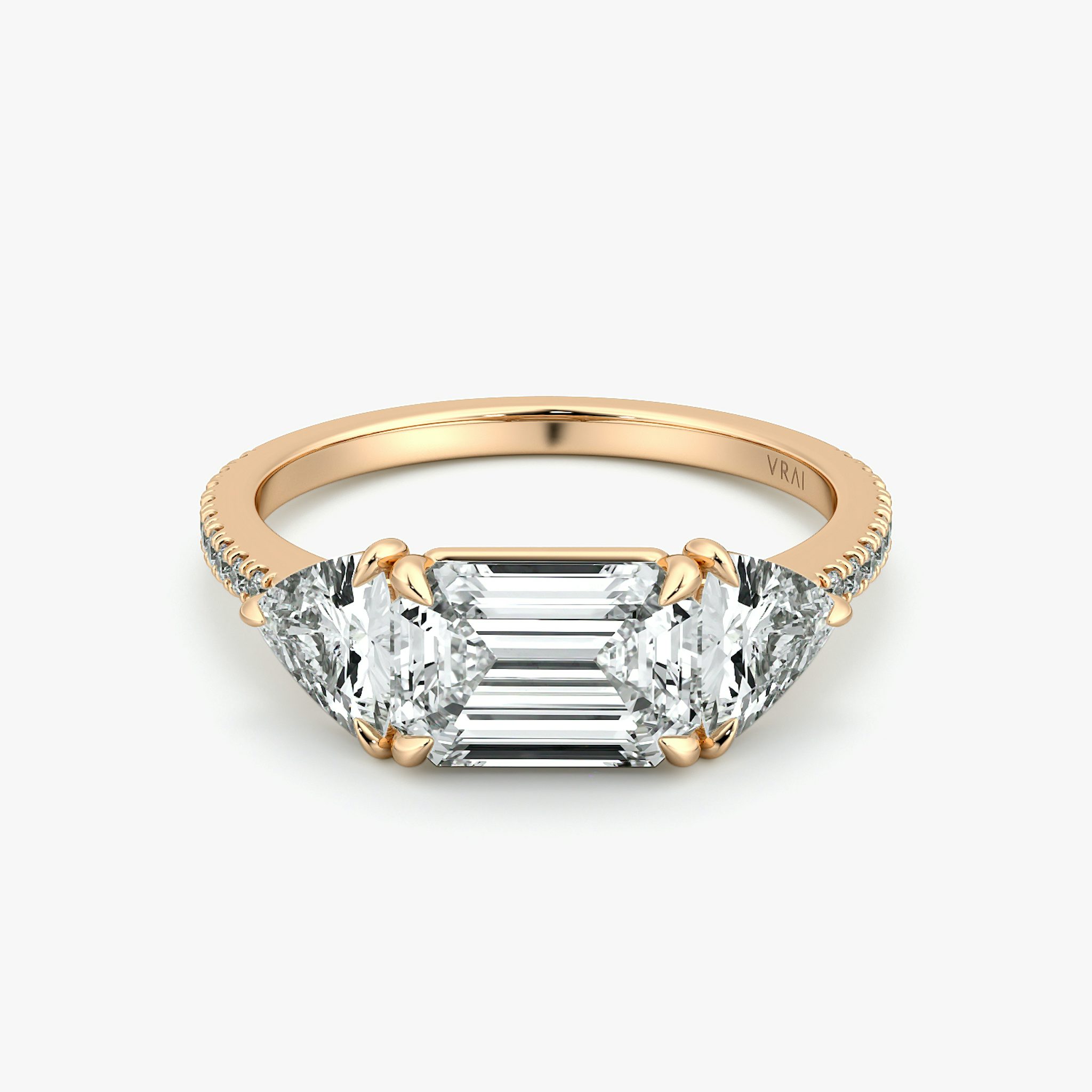 The Three Stone | Emerald | 14k | Rose Gold | bandAccent: Pavé | diamondOrientation: horizontal | sideStoneCarat: 0.50ct | sideStoneShape: Trillion | caratWeight: other