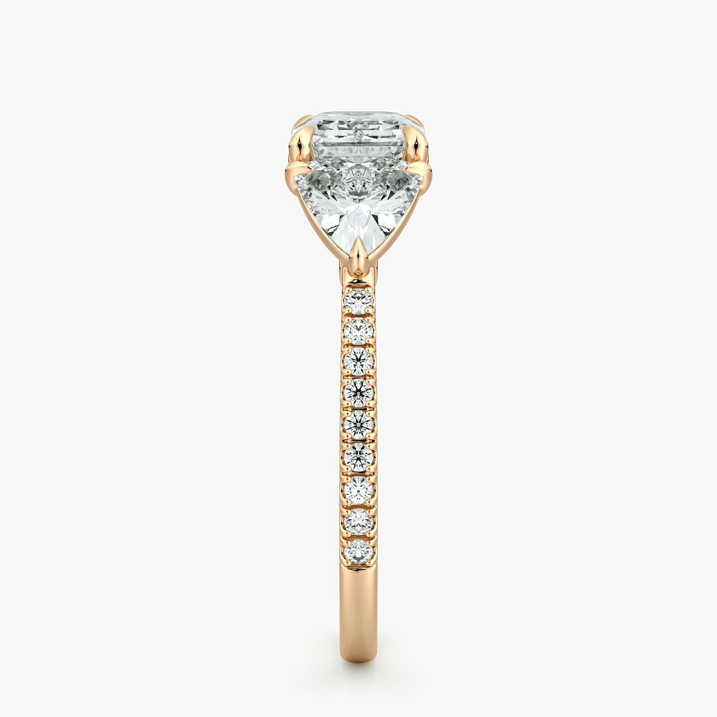 The Three Stone | Emerald | 14k | Rose Gold | bandAccent: Pavé | diamondOrientation: horizontal | sideStoneCarat: 0.50ct | sideStoneShape: Trillion | caratWeight: other