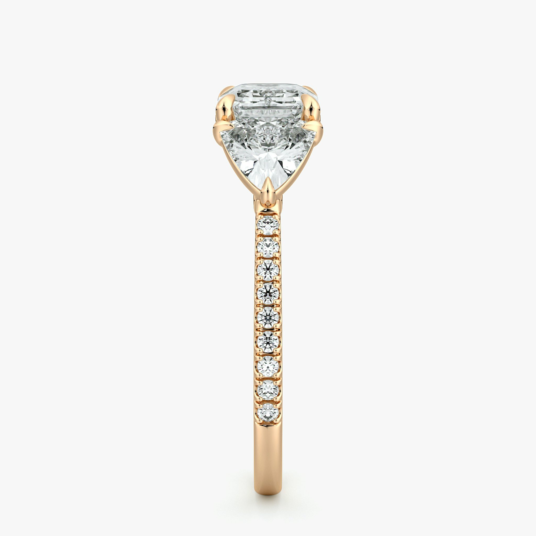 The Three Stone | Emerald | 14k | Rose Gold | bandAccent: Pavé | diamondOrientation: horizontal | sideStoneCarat: 0.50ct | sideStoneShape: Trillion | caratWeight: other