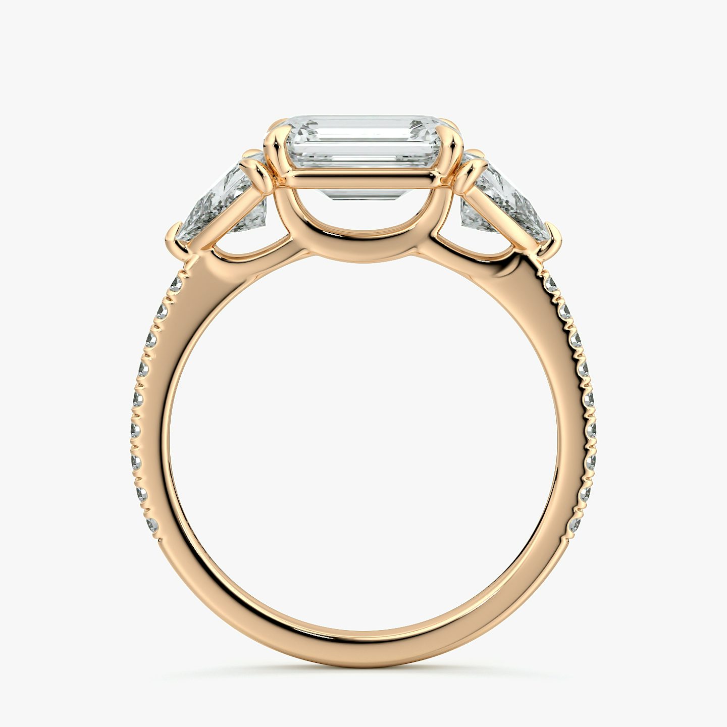 The Three Stone | Emerald | 14k | Rose Gold | bandAccent: Pavé | diamondOrientation: horizontal | sideStoneCarat: 0.50ct | sideStoneShape: Trillion | caratWeight: other
