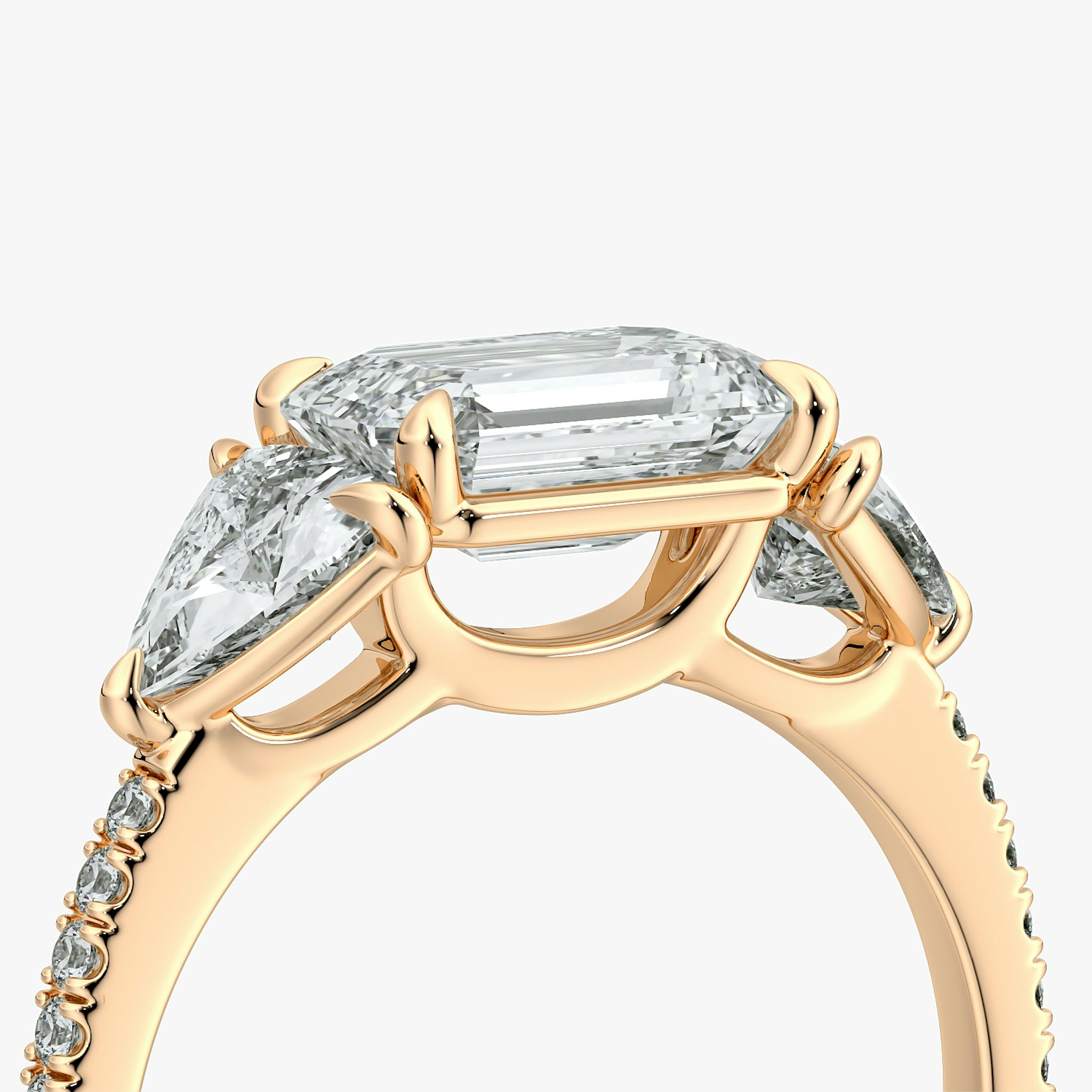 The Three Stone | Emerald | 14k | Rose Gold | bandAccent: Pavé | diamondOrientation: horizontal | sideStoneCarat: 0.50ct | sideStoneShape: Trillion | caratWeight: other