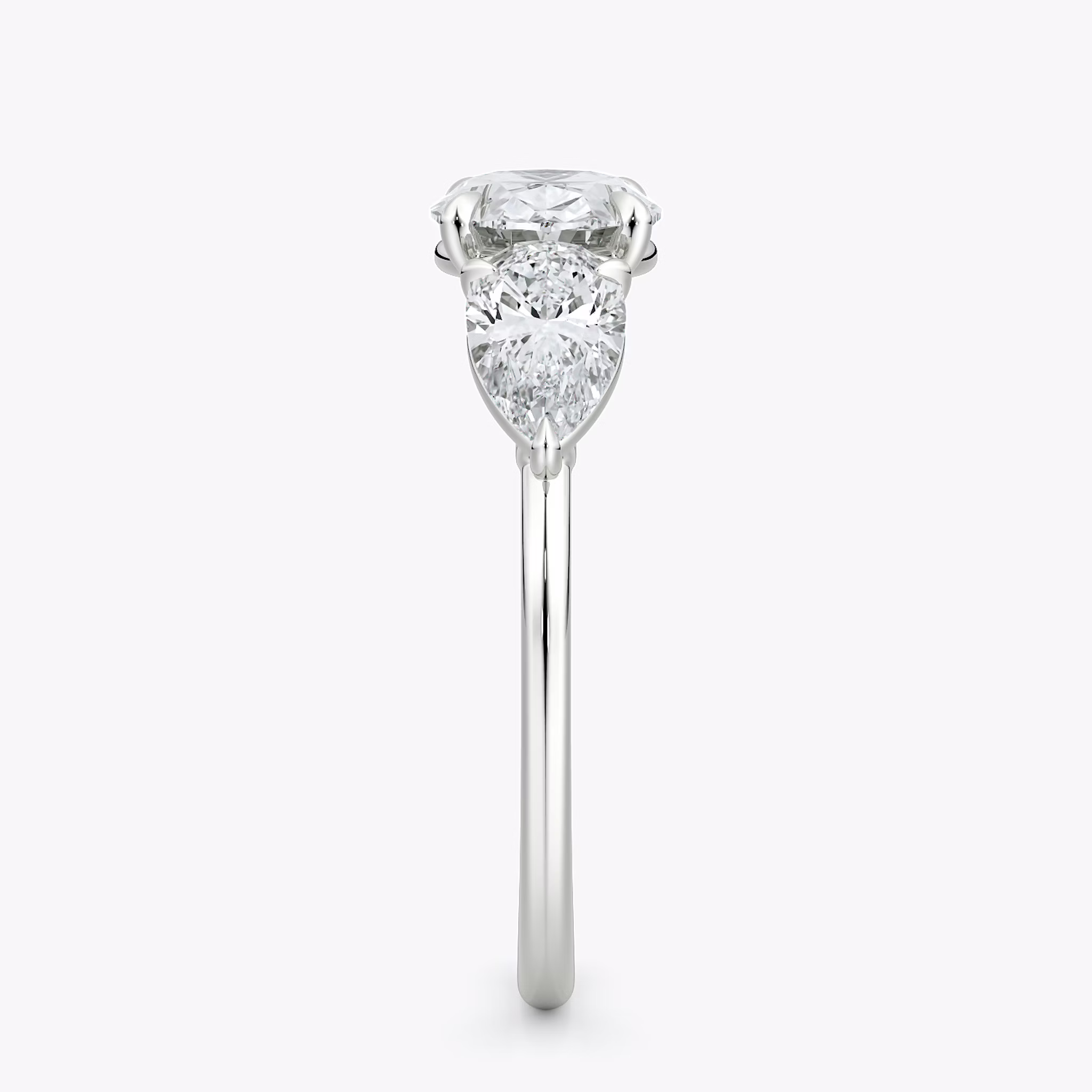The Three Stone | Oval | 18k | White Gold | bandAccent: Plain | diamondOrientation: horizontal | sideStoneCarat: 0.50ct | sideStoneShape: Pear | caratWeight: other