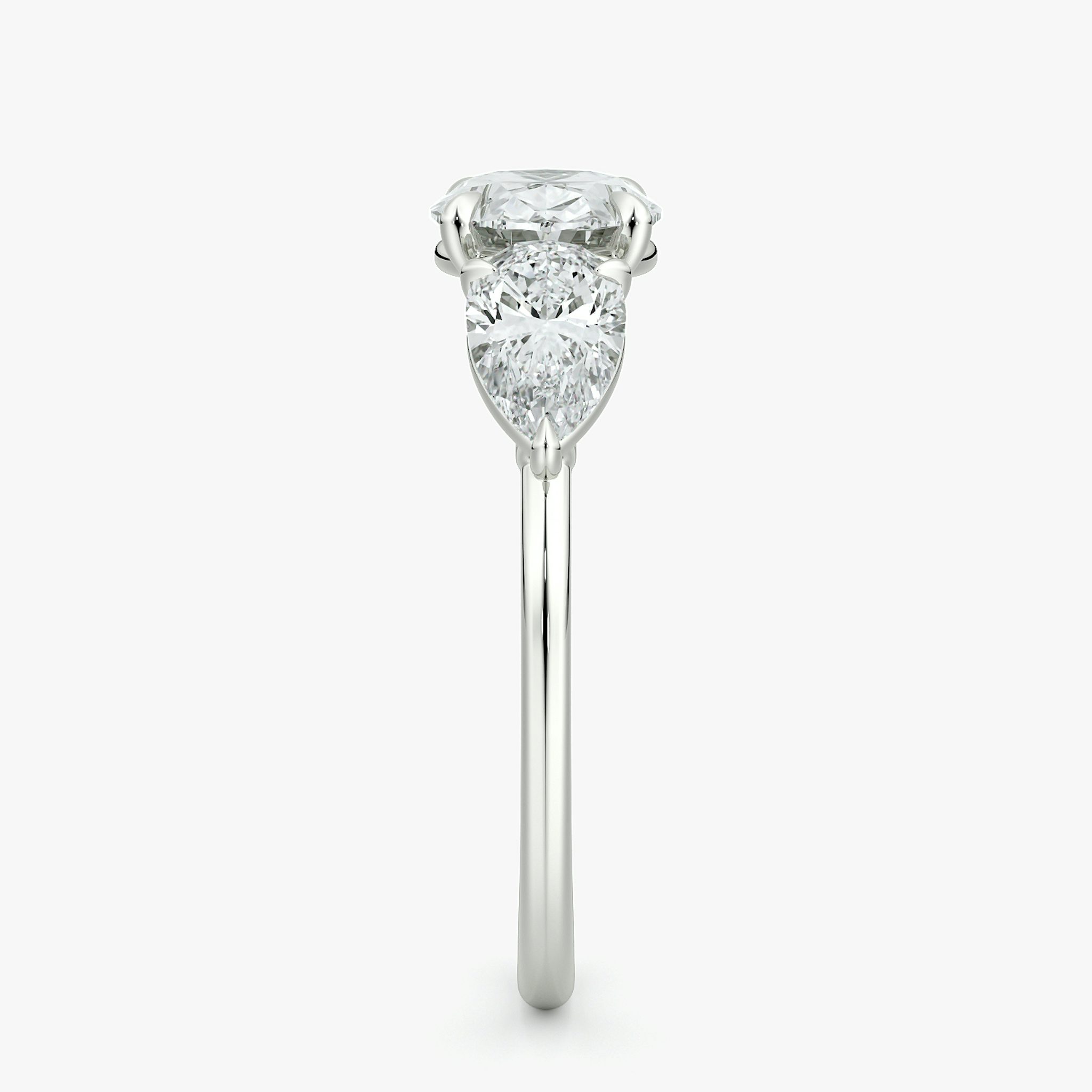 The Three Stone | Oval | 18k | White Gold | bandAccent: Plain | diamondOrientation: horizontal | sideStoneCarat: 0.50ct | sideStoneShape: Pear | caratWeight: other
