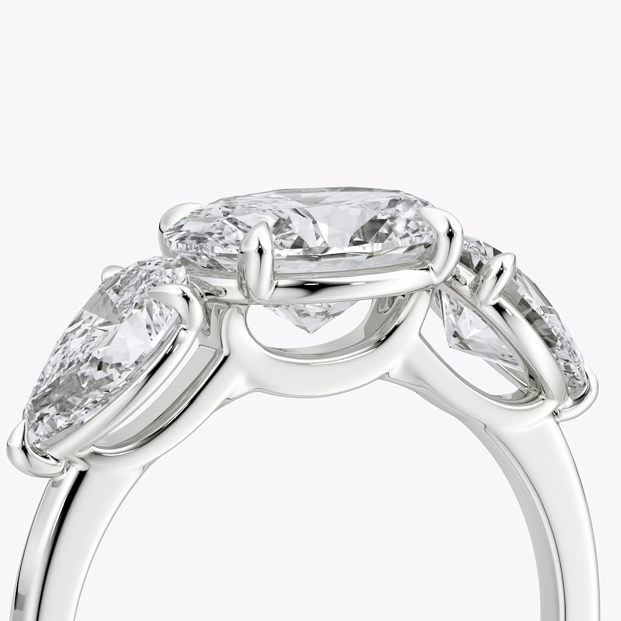 The Three Stone | Oval | 18k | White Gold | bandAccent: Plain | diamondOrientation: horizontal | sideStoneCarat: 0.50ct | sideStoneShape: Pear | caratWeight: other